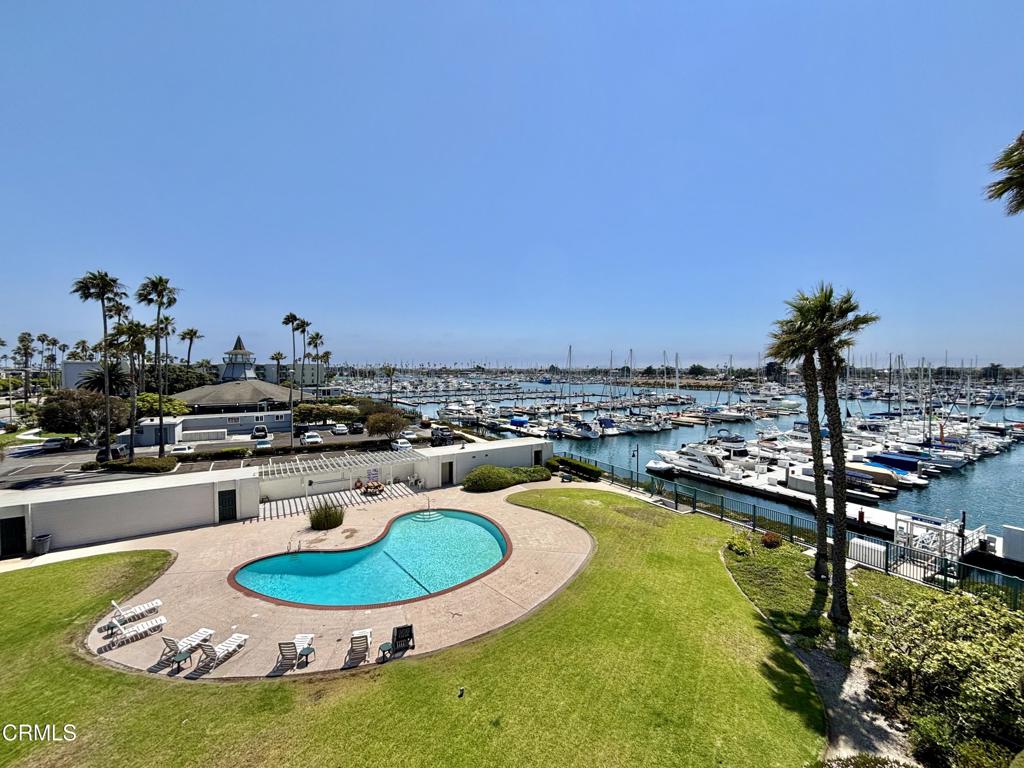 Enjoy stunning marina views from this spacious 1-bedroom, 1-bath top-floor condo overlooking the Channel Islands Marina. Just five minutes from the beach, shops, and restaurants, this beautifully situated home offers the ideal blend of coastal living and everyday convenience.The open-concept layout features a well-appointed kitchen with bar seating, perfect for casual dining and entertaining. The living room opens directly to a private patio through sliding glass doors, allowing for seamless indoor-outdoor enjoyment of the waterfront setting.Community amenities include one assigned underground parking space, Tennis courts, access to a sauna in the two locker rooms, a clubhouse, full gym, and three swimming pools--one heated year-round at the clubhouse, and two additional pools heated during the summer months. A Jacuzzi and laundry facilities complete the offering.Set in a highly desirable marina-side community, this condo is an exceptional opportunity to live just steps from the water in one of Oxnard's most sought-after coastal neighborhoods.