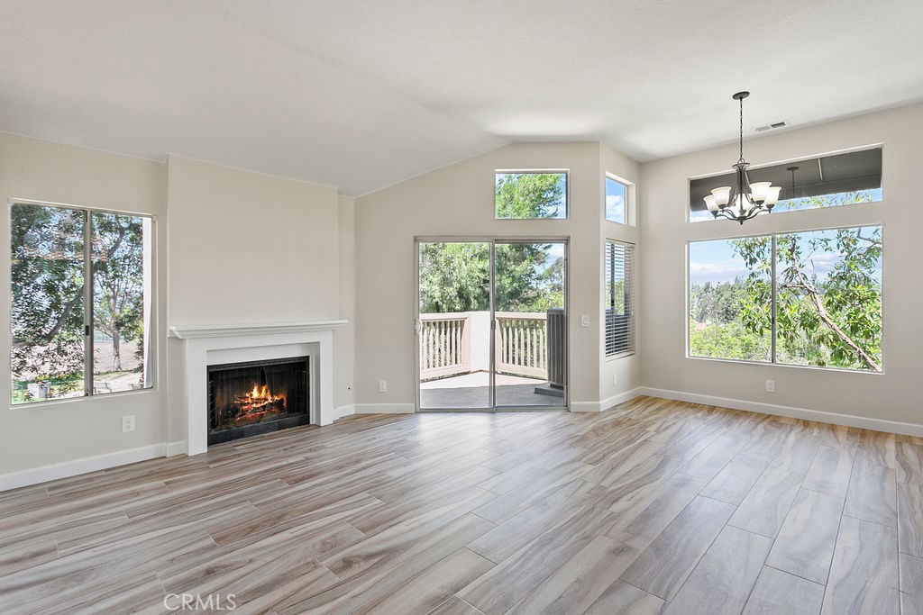 Available August 24th! Perched on one of the best view lots in Upper Palm Court, this beautiful end-unit condo offers serene tree-lined and canyon views from the private balcony, living room, and kitchen. Vaulted ceilings and an open layout create a bright, airy atmosphere, while tasteful updates—including newer paint, carpet, light fixtures, toilets, and air conditioning—make the home feel fresh and move-in ready. The thoughtful floor plan includes two bedrooms and two full bathrooms. The spacious primary bedroom features an ensuite bath, while the second bedroom is located near the main hallway bath, perfect for guests. Enjoy the convenience of direct access to the attached one-car garage via an interior staircase—no need to walk outside! Community amenities include tennis courts, pools, a spa, and a tot lot. Ideally located near shopping, Chaparosa Park, and just minutes from Dana Point Harbor and beautiful local beaches. You can even hop on your bike and ride the trails all the way to the coast!