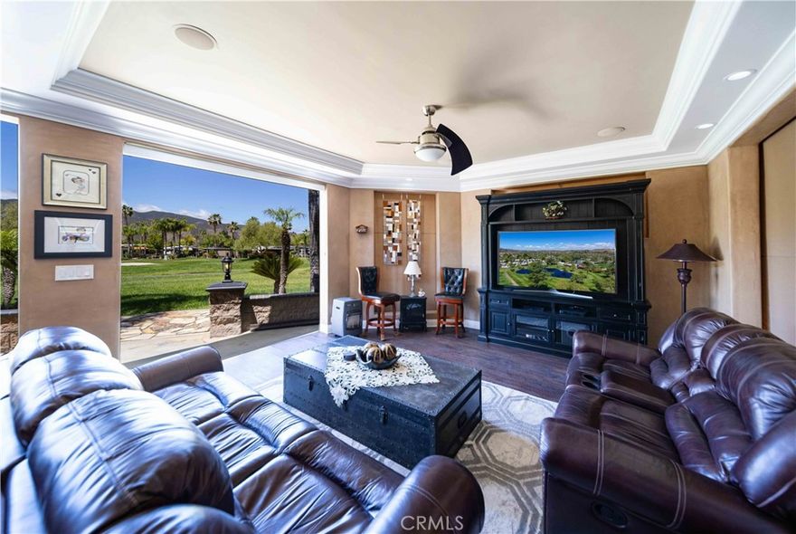 Gorgeous custom built fully enclosed with shade screens home on the Golf Course with sunsets to die for. Huge build-out with laundry room, storage and huge family room, dining room and Kitchen, 5 electric power screens, and gorgeous crown moldings with soffits. Kitchen is dialed in with residential wood cabinets, tile back splash and gorgeous counters with oven, stove top and microwave. Dining room even has a chandelier and expandable table and wood colored floors. Ceiling fans are a perfect accent to this decor and style. Patio is set up for those late night dinners overlooking the sunsets and golf course and pond with matured landscaped sego palms, low maintenance. Owner will carry paper. Right around the corner from main clubhouse and pool. Rancho California RV Resort provides amenities such as a 14 hole Executive PAR 3 Golf Course (no fees for owners), 5 Pools/Jacuzzis, Tennis courts, Pickleball courts, Dog park, Club house, hiking trails, Horseshoe lawn and onsite grocery market. The resort is guard gated with no age restrictions. Monthly HOA fee includes unlimited use of the golf course, amenities, trash pickup at lot, water/sewer and common area maintenance. If you are considering a premier Southern California RV destination with convenient access to San Diego, Palm Springs and SoCal beaches, don't miss out on visiting Rancho California RV Resort. **FINANCING AVAILABLE**