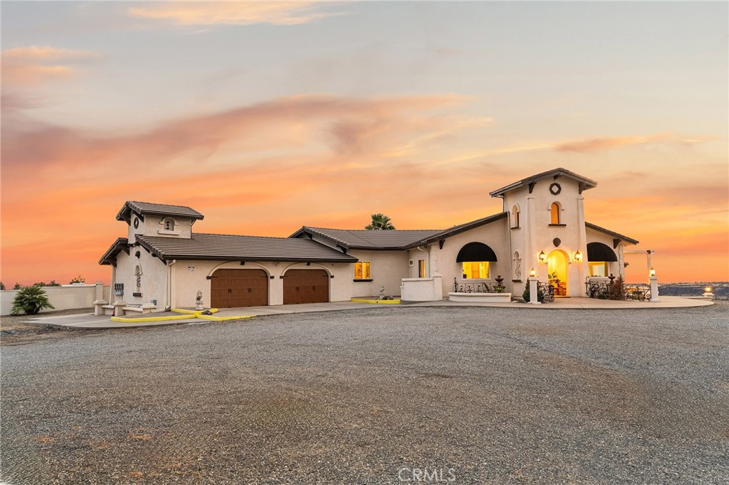 Welcome to Grey Stone Estate, a European inspired villa escape with Canyon and City Light Views. This private, gated 10-acre estate combines timeless European villa style with sweeping 180-degree views. This spacious open-concept home features a split-bedroom layout, offering both comfort and privacy. The expansive primary suite is a true retreat, complete with a luxurious spa-inspired bathroom, sitting area, fireplace and direct access to a private outdoor spa—perfect for unwinding under the stars. Inside, newer flooring and windows enhance the home’s light-filled design, while the chef’s kitchen provides abundant counter space, two sinks, and generous storage for effortless entertaining. With 3 spacious bedrooms, 3 bathrooms, a dedicated office, and an additional lounge area, the flexible floor plan adapts easily to your lifestyle. Enjoy breathtaking city lights at night and a bird’s-eye canyon view by day from multiple vantage points throughout the property. Whether hosting gatherings or relaxing with loved ones, this estate offers an unparalleled setting of beauty and privacy—all with quick access to both Chico and Paradise.