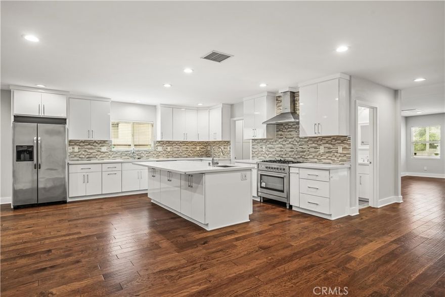 Come see this beautiful Encino Park home with a modern open concept floor plan. Step into the foyer which leads you to an open living area, dining area, then to the expansive center island cooks kitchen. Amazing glossy white soft close cabinets, Marble backsplash, smooth surface Quartz counters, stainless sinks & stainless appliances. Adjacent is a convenient walk-in pantry with loads of storage. Opposite is an open family room that accesses a spacious yard with a covered patio. There are 4 bedrooms 3 baths. One bedroom would make a great office with its double pocket doors and closet. The beautiful large master suite has a modern touch. A magnificent walk-in ceramic tiled shower, dual vanity with Quartz counters, plus a walk-in closet, recessed lighting, beautiful engineered hardwood floors, new custom moldings, New polished chrome fixtures, fully dry walled finished Direct access garage with New sectional door with auto opener and more. Easy access to the 101 freeway. Close to Ventura Blvd, Trader Joes, shop, restaurant and many more. This one won't last!
