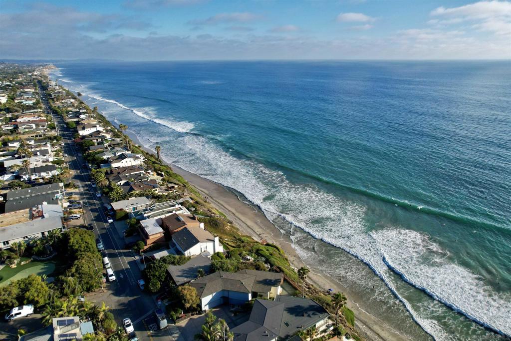 Located less than 2 miles from the beach with a low HOA, this charming Cape Cod-style 2 bed, 2 bath home with a one-car garage is tucked away in a small, hidden gated community west of the 5 in Leucadia. Vaulted ceilings, skylights, French doors, fireplace and abundant windows fill the open floor plan with natural light, creating a bright and airy ambiance. The spacious primary suite features a cozy fireplace, a huge walk-in closet, and an oversized bathroom with a walk-in shower and granite counters. The upgraded kitchen boasts granite countertops, pull-out drawers in all cabinets and pantry, and a cozy breakfast nook overlooking the lush garden. The private patio is surrounded by fruiting plants, offering a peaceful outdoor retreat. The meticulously maintained community features lush landscaping throughout and offers amenities including a sparkling pool, spa, tennis/pickleball courts, and a large BBQ area—all just a short walk away. Additional upgrades include newer windows, water heater, and heater. Coastal living at its finest—close to everything, yet peaceful and private. Located less than 2 miles from the beach with a low HOA, this charming Cape Cod-style 2 bed, 2 bath home with a one-car garage is tucked away in a small, hidden gated community west of the 5 in Leucadia. Vaulted ceilings, skylights, French doors, fireplace and abundant windows fill the open floor plan with natural light, creating a bright and airy ambiance. The spacious primary suite features a cozy fireplace, a huge walk-in closet, and an oversized bathroom with a walk-in shower and granite counters. The upgraded kitchen boasts granite countertops, pull-out drawers in all cabinets and pantry, and a cozy breakfast nook overlooking the lush garden. The private patio is surrounded by fruiting plants, offering a peaceful outdoor retreat. The meticulously maintained community features lush landscaping throughout and offers amenities including a sparkling pool, spa, tennis/pickleball courts, and a large BBQ area—all just a short walk away. Additional upgrades include newer windows, water heater, and heater. Coastal living at its finest—close to everything, yet peaceful and private.