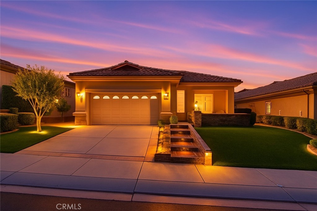 This TRILLION is THE ONE!!! Tucked behind the gates of the highly coveted Sun Lakes Country Club, this beautifully updated 2-bedroom, 2-bath home offers the perfect blend of elegance, low-maintenance living, and resort-style amenities designed for those 55 and better. This home is not just beautiful - it has also been METICULOUSLY MAINTAINED! With 1,683 sq ft of meticulously maintained living space on a 6,970 sq ft lot, this home is truly a standout.
Discover an open-concept layout filled with natural light, designer touches, and a seamless flow. The expansive living room boasts high ceilings, upgraded LED recessed lighting, and wide-plank luxury vinyl flooring throughout. Cozy up by the refreshed fireplace or host guests in the inviting dining area—this space is as versatile as it is beautiful. The chef’s kitchen features gorgeous granite countertops, a full white subway tile backsplash, updated cabinet hardware, and stainless steel appliances. The layout is perfect for entertaining, with a large peninsula that comfortably seats guests and opens to the great room.
When it’s time to unwind, retreat to the spacious primary suite featuring shutters, plush carpet, and a walk-in closet with built-in organizers. The en-suite bathroom has been upgraded with dual sinks, granite countertops, and a separate soaking tub and walk-in shower for the ultimate spa-like feel. A dedicated laundry room with added cabinetry and a sink adds both convenience and storage.
But the true magic awaits outdoors...
The backyard is a private oasis, with a custom aluminum patio cover, built-in lighting, and a peaceful seating area with mountain and hillside views. The professionally landscaped terraced hill creates a gorgeous backdrop and added privacy—perfect for al fresco dining or simply enjoying the California sunsets. And don’t miss the low-maintenance artificial turf, extensive hardscape upgrades, and ambient twilight landscape lighting that make this space shine both day and night.
Located in the prestigious 55+ Sun Lakes Country Club, you'll enjoy championship golf, multiple clubhouses, swimming pools, tennis and pickleball courts, fitness centers, walking trails, and a vibrant calendar of social events and activities—all just minutes from your front door. This home - in this community is the true pinnacle of LIFESTYLE!
Priced to sell quickly, this home checks all the boxes—Don’t wait, a home like this rarely lasts.