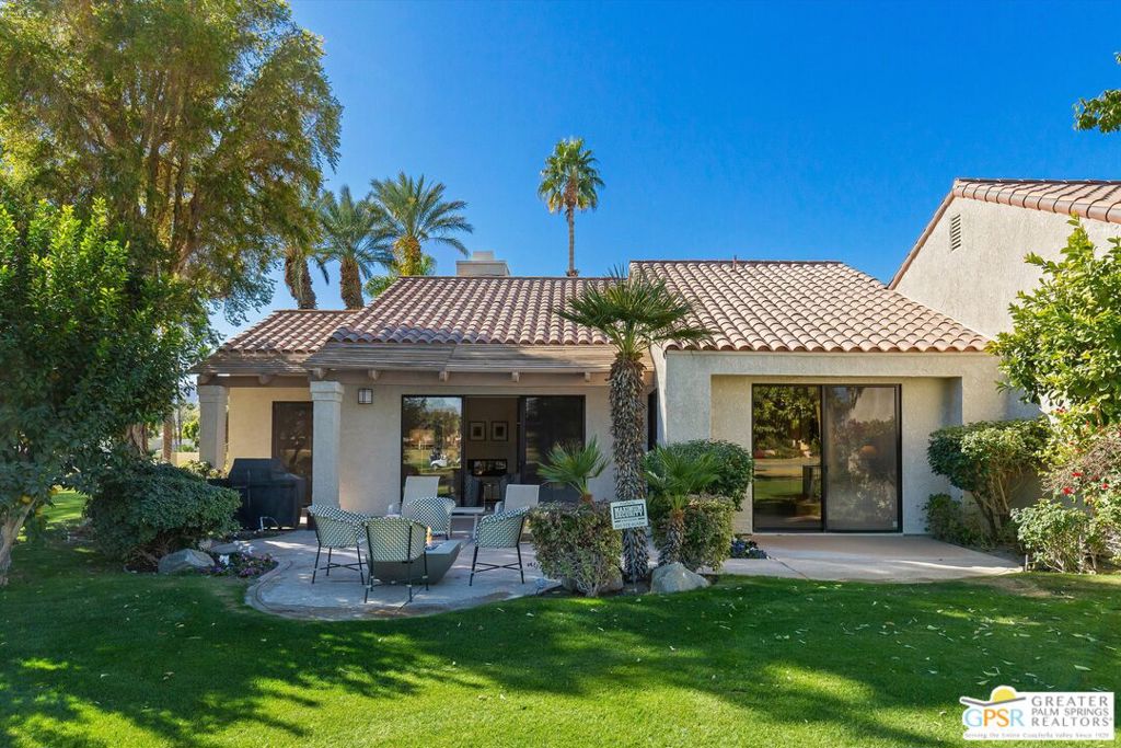 The winner is YOU - The sellers have outgrown this exquisitely renovated end-unit greenbelt residence nestled within the prestigious Mission Hills Country Club. NOW vacant and priced to sell with Immediate occupancy available for you to personalize just in time to enjoy for this season. Indulge in a lifestyle of unparalleled luxury with DUAL spacious primary suites, each featuring a private spa-like bath, PLUS a versatile den/office/media room that can easily serve as a third bedroom. Prepare to be captivated by the dramatic architecture, showcasing soaring vaulted ceilings, striking architectural raked walls, and a warm and inviting ambiance. Expansive windows frame panoramic views of the majestic mountains, lush greenbelts, and golf course, creating a truly awe-inspiring backdrop for everyday living. The open concept living area seamlessly flows from the main hallway, featuring a cozy gas fireplace and flows to the adjacent den/office/media OR Convertible THIRD Bedroom. Entertain with effortless grace in the inviting dining area, adjacent to the bright and modern fully equipped kitchen with soothing views bringing the outdoors in. Both primary bedrooms are generously proportioned, offering serene retreats with pleasing outlooks to the amazing greenbelts and mountains. Pamper yourself in the fully renovated en-suite bathrooms, designed for ultimate relaxation. Step outside to your private outdoor oasis with a rear sun patio complete with a firepit and gas BBQ area. Enjoy tranquil views of the Santa Rosa Mountains from the 14th green (par 5) of a championship Pete Dye course, while the picturesque mountain backdrop provides a stunning backdrop. Located next to a wide green belt for extra privacy and outdoor activities. Peace of mind comes standard with a long-term land lease extending for another 96 years! Moreover, the combined HOA fees and lease rate combined are exceptionally competitive compared to neighboring communities HOA fees. Convenience meets practicality with an oversized two-car garage that also accommodates a golf cart and offers ample additional storage space. Schedule your private showing today and find your dream home awaits with immediate occupancy available.