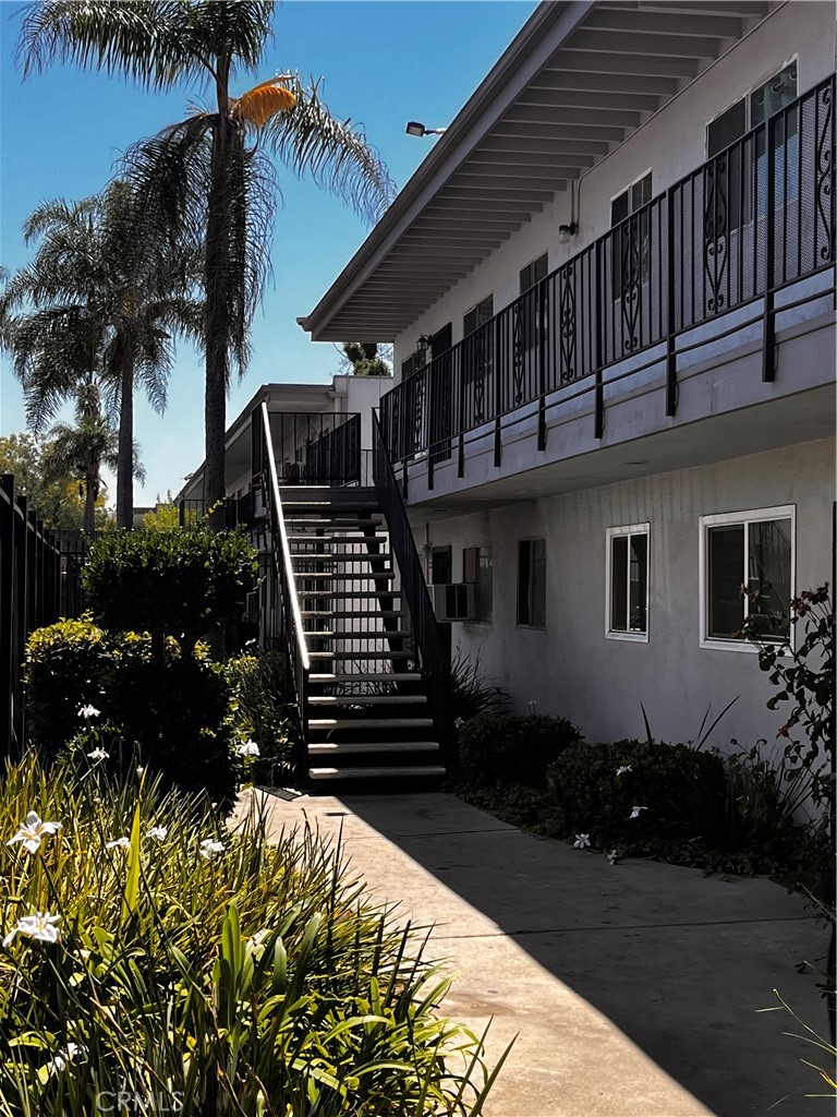 This upgraded 2-bedroom, 2-bath top-floor end-unit condo in the gated Ackerfield Community of Long Beach offers a combination of space, comfort, and value. Suitable for first-time buyers, downsizers, or investors, the home is move-in ready and well-maintained. The kitchen features maple-finished cabinetry, black granite countertops, stainless steel appliances, and porcelain tile flooring. The living and dining areas have laminate wood-style flooring and updated designer paint throughout. Both bathrooms have been improved with granite vanity tops, porcelain finishes, new faucets, lighting, and commodes. The primary suite includes dual closets—one of which is a walk-in—and a six-foot granite countertop with additional storage space. The secondary bedroom also has dual closets. The unit includes two assigned parking spaces (one carport w storage, one uncovered) in a gated community with 24-hour surveillance. Additional amenities include a community pool and BBQ area. The community allows pets and offers a secure, well-kept environment. Located near the 91 and 710 freeways, the property provides easy access to Lakewood Mall, schools, parks, and Long Beach’s coastal amenities. VA financing is approved. FHA financing may be available through spot approval—recent sales support this possibility. Interested buyers should contact the listing agent for more information. This unit offers a rare opportunity to own in an established Long Beach neighborhood at an affordable price, with practical updates and strong long-term value. Sold Offmarket- For MLS Comp purposes only