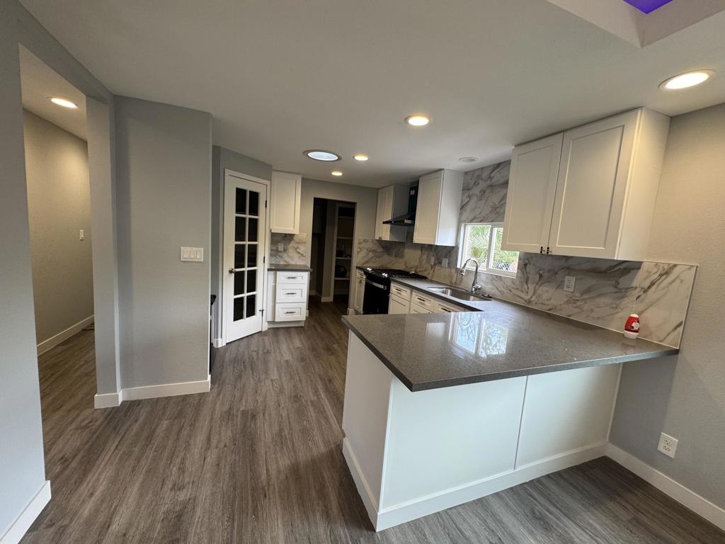 Welcome to this beautifully remodeled 4-bedroom, 2-bath manufactured home, where modern comfort meets affordability! Featuring a spacious open-concept layout, fresh interior and exterior paint, updated flooring, new fixtures, and a fully upgraded kitchen with beautiful oven. This floor plan offers functionality, perfect for families or multi-generational living. Nestled on a generous lot with ample parking and outdoor space -- this move-in ready home is a must-see!