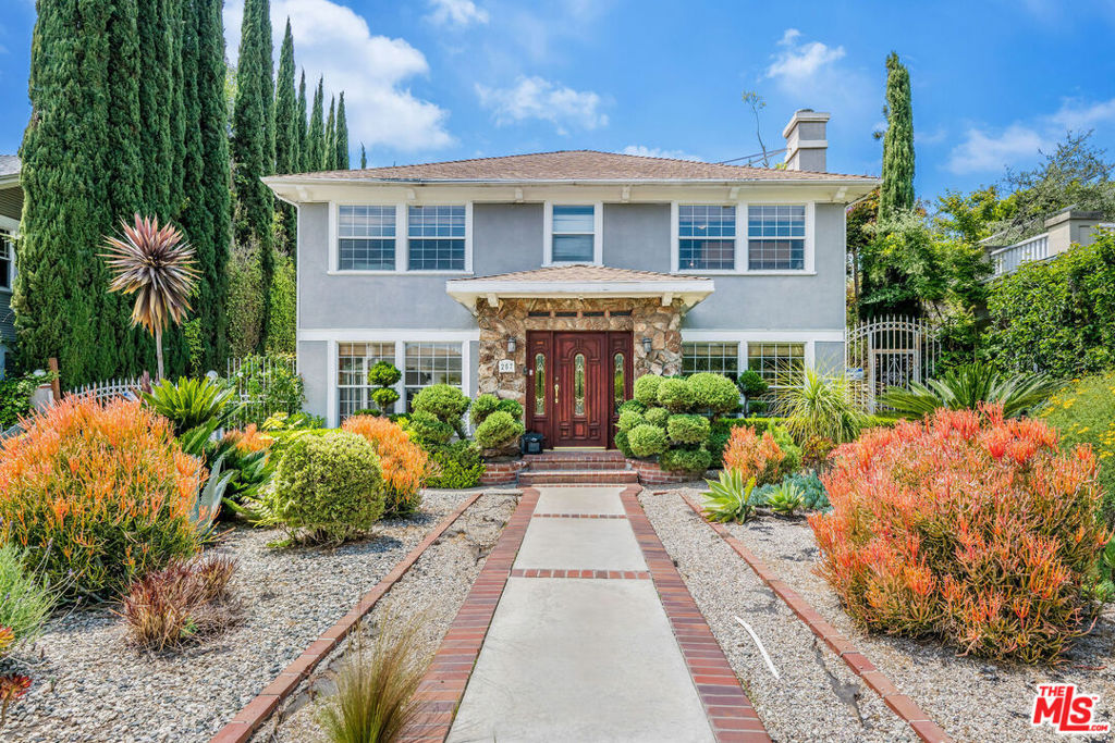 Set on one of Windsor Square's most iconic tree-lined streets, 257 S Van Ness is a classic California two-story traditional that offers elegance, scale, and endless potential. With over 3,600 square feet of living space, 5 bedrooms, and 3 bathrooms, the home delivers a perfect layout and a sense of ease that's increasingly rare. Updated over the years and meticulously maintained, the interiors are welcoming and thoughtfully configured. The kitchen is a standout anchored by a central island, with ample counter space and room for a dining table - it's both highly functional and designed for connection. Whether cooking casually or entertaining a crowd, it's the heart of the home in the best possible way. The family room opens to the backyard and sits below an 800+ square foot flat roof deck, ideal for an expansion or rooftop retreat. Set on an over 10,000 square foot lot, the property offers a large, private yard and a detached garage ready for transformation into a guesthouse or ADU. Located in the Third Street School district and protected by the Windsor Square HPOZ, this is a home that blends comfort, location, and architectural presence just blocks from the best of Larchmont Village. Live beautifully as is, or bring your vision to life 257 S Van Ness Ave is the kind of home that rarely comes to market, and never stays long.