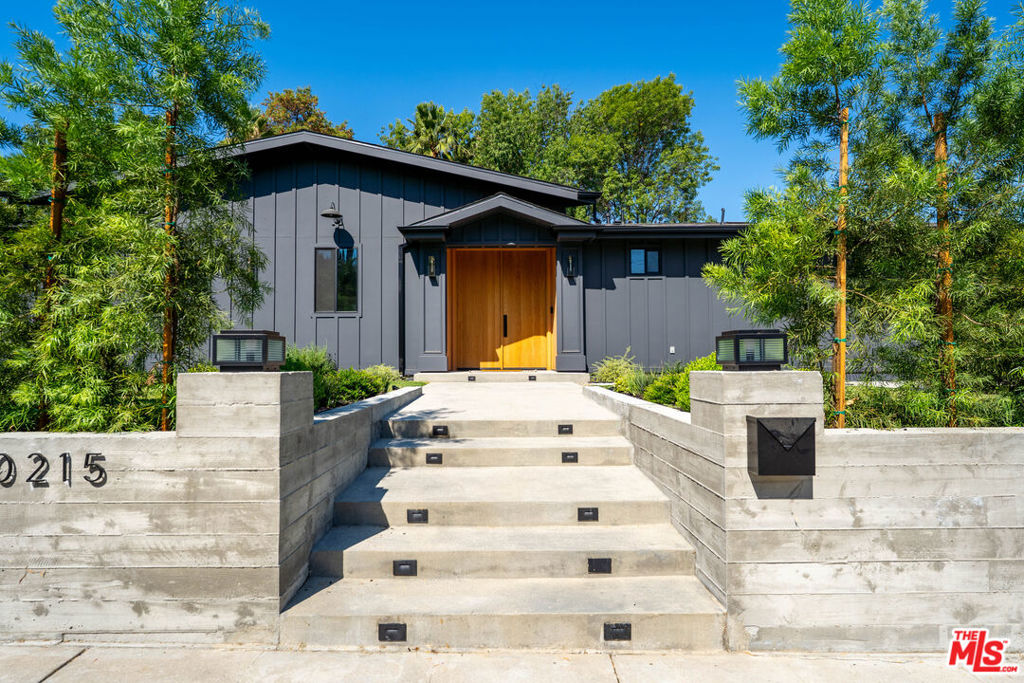 Beautifully updated single-story modern farmhouse located south of the boulevard in coveted Vista De Oro. This spacious home offers high ceilings, wide plank wood floors, and abundant natural light throughout. The open-concept layout features a chef's kitchen with a large center island, quartz countertops, custom cabinetry, and premium appliances, perfect for both everyday living and entertaining.The primary suite opens directly to the backyard and boasts a spa-like bath with soaking tub, oversized shower, and a boutique-style walk-in closet. Three additional bedrooms each include their own en-suite bathrooms for comfort and privacy.The private backyard is an entertainer's dream with a newly updated pool, sport court, and multiple areas for lounging or dining outdoors. Close to top-rated schools, shops, and restaurants.