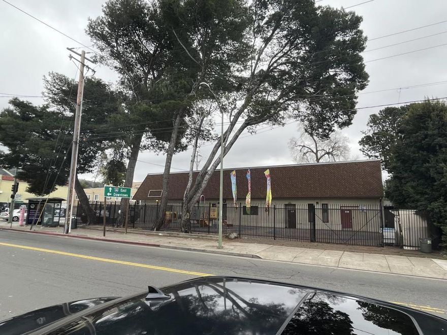 Awesome high-traffic commercial corner located at the signalized intersection of MacArthur Blvd, Seminary Ave, and Camden Street, offering exceptional visibility and access. Positioned just across the street from Northeastern University / Mills College and moments from Highway 580, this location is ideal for commuters, students, neighborhood traffic, and destination users.  The property features a large fenced lot with 16+ parking spaces  The site is also located within an Opportunity Zone, making it attractive for investors and long-term redevelopment strategies.  With flexible zoning and a wide range of potential uses, this property lends itself to a variety of commercial and mixed-use opportunities including:  Day care / school  Medical or dental office  Veterinary clinic / animal hospital  Retail or neighborhood grocery  Office or flex space  Potential residential or mixed-use redevelopment (height limit up to 6 stories, buyer to verify)