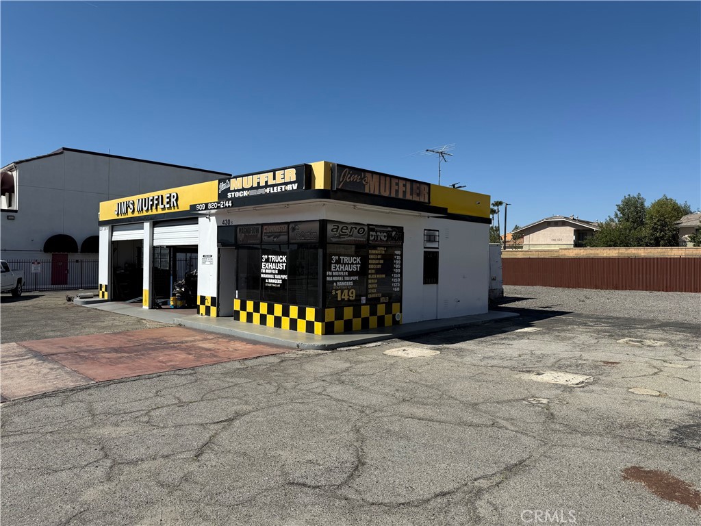 The property consists of around 1,125 square feet on a lot of approximately 21,150 square feet. It has operated as Jim's Performance Mufflers, specializing in exhaust tip and catalytic converter services, at this location for 38 years. The zoning designation is DMUZ, allowing for various permitted uses including Medical, Dental, and Health Related Offices & Services, Laboratories, Automobile Accessory Stores, Automobile Sales (including used cars) with incidental service and repairs, drive-through facilities, equipment rental and repair, among others.