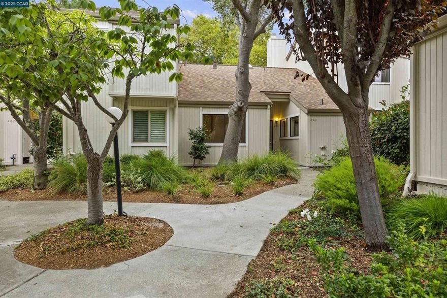 This light-filled single-level condo offers the perfect blend of comfort, convenience, and style. Freshly updated with new flooring and fresh paint, this home is move-in ready and ideal for downsizers, first-time buyers, or anyone seeking a low-maintenance lifestyle with a touch of outdoor space.  Inside, vaulted ceilings and skylights create an airy, open atmosphere. The living room features a cozy fireplace and large sliding glass doors that open to a private fenced patio — perfect for relaxing, gardening, or entertaining friends. The adjacent dining area flows into a functional kitchen with tile counters, stainless appliances, and direct access to a laundry room with bonus storage and workspace.  Two spacious bedrooms provide flexibility, including a primary retreat with patio access. The full bath is centrally located, and multiple closets throughout ensure plenty of storage.  The new homeowner will enjoy access to Moraga’s award winning schools, hiking and walking trails and shopping. Don’t miss this great opportunity to call Moraga home!