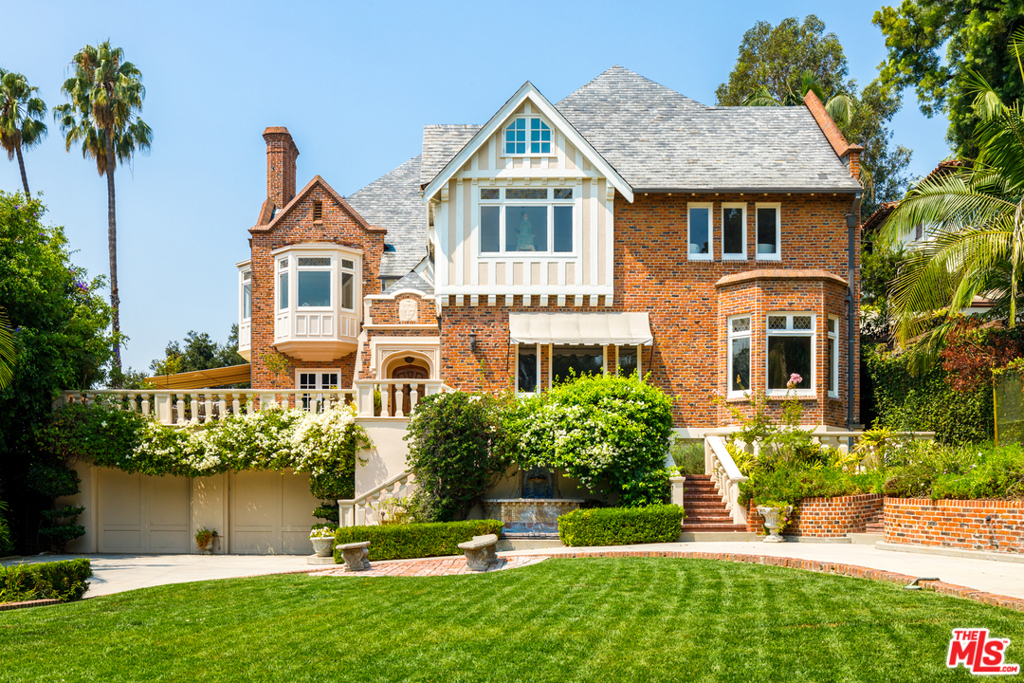 The Legendary Glendower Estate. The former Russian Consulate set behind majestic gates and up a private drive to an extraordinary residential compound with warmth, scale, quality and design rarely seen today. Grand scale public rooms flow to wraparound entertainment terraces with city views and expansive gardens. Magnificent entrance hall with sweeping staircase. Incredible period details include custom woodwork, leaded glass, beamed ceilings & parquet floors. Warm and inviting spaces to gather and enjoy city to ocean views, lush secret gardens, large flat lawns, inviting pool and spa, dinners on the expansive terraces and more. Multi-room Master wing with sitting room and beautiful bath. Generous family bedroom suites and a large 2nd floor courtyard terrace. Screening room with bar and lounge. Lower level include additional media room, game room, gym, offices, wine cellar and guest house with kitchen and separate entrance. This is a one of a kind trophy estate property priced to sell.