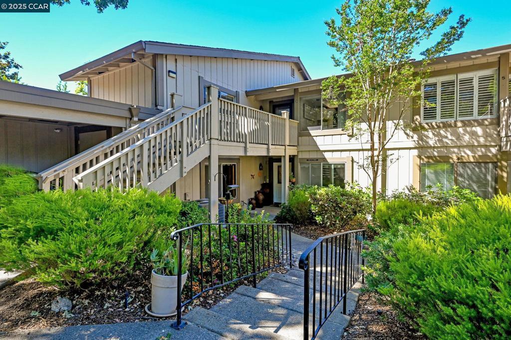 Great Price! Great Opportunity! Gated Community! WOW - Mariposa model -Level Entry - No stairs! 1 Level floor Plan. 1 Car Garage. Beautiful views of the surrounding hillside. Enclosed Sun Porch/Patio w/sliding glass door and screen, Access to backyard common lawn area. Great location in Rossmoor, 2-3 min to entry. Updated w/new carpet, lots of natural light, open concept floor plan, Large Kitchen & Eating Area, Lg Living Room, Dining Room, and Master Suite! Updated Master Bathroom. Master has entry to sun porch. Living room also has entry to sun porch. Nice size Master suite and 2nd Bedroom! Beautiful Oak Tree in front of unit in sitting area.