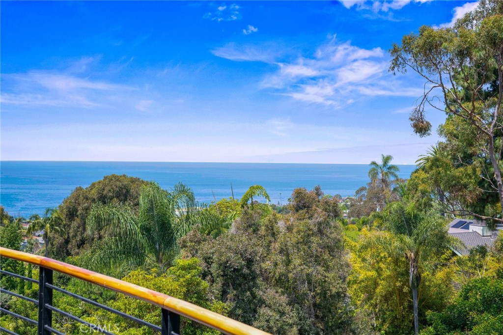 Discover this exceptional modern home with sleek industrial accents set in one of Laguna Beach's most coveted beach close neighborhoods just moments to Woods Cove, fine Dining and Trolly access to everything "Laguna". Thoughtfully designed with an open floor plan ideal for daily living and entertaining, this special home seamlessly blends contemporary style with coastal close comfort. Enjoy sublime island and ocean views from multiple vantage points throughout the home in a setting surrounded by lush foliage and the sounds of nature. Expansive windows and sliding glass doors fill this home with natural lighting, enhancing the airy and open feel. The spacious living and dining areas flow effortlessly into a stylish kitchen with ample counter space and a large bar top- ideal for casual living and elevated entertaining. The secondary bedrooms adjoin a large family room with a fireplace that opens to an inviting view deck. With its multiple gathering spaces and decks, this home is perfect for enjoying the coastal lifestyle and ocean breezes year -round. 686 Diamond is a true gem for those seeking design, comfort and an unbeatable location.