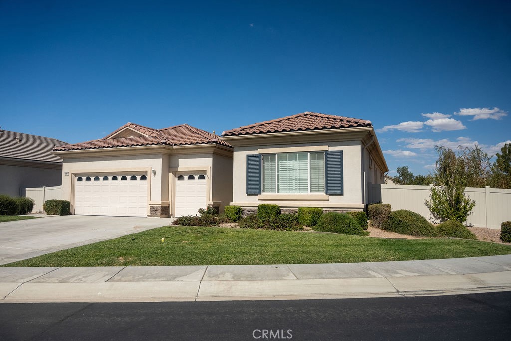 Beautiful upgraded home in the 55+ community of Sun City! Located at the end of a cul-de-sac, this home features 2 bedrooms, each with their own private bathrooms in a split floorplan. Each have walk-in closets, the master closet is huge with floor to ceiling custom built shelving systems. The second bedroom closet also has custom shelving systems with tons of storage. Between them is a large den with double door entry and a guest bath. Well designed kitchen that opens to the dining area and great room. Two-and-a-half car garage also features built in cabinetry that goes from floor to ceiling. The backyard is bigger than most in Sun City, and has a covered patio that is perfect for a relaxing evening meal and big enough for entertaining a large party. Don't sleep on this one!