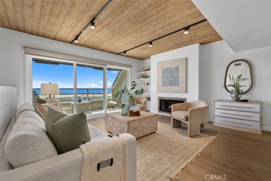 Perched high above Treasure Island Beach and The Montage Resort in the gated enclave of Laguna Vista, this elegant coastal retreat blends effortless sophistication with panoramic ocean views. The entry level greets you with double doors and a sense of calm. The primary suite is a serene retreat with a fireplace and spa-inspired bath, while a spacious guest suite enjoys its own private bath. Ascend the staircase to a sun-drenched upper level where sliding glass doors lead to a deck with sweeping Pacific views. The open-concept design seamlessly connects the elegant living and dining spaces to a thoughtfully appointed kitchen and powder room; perfect for hosting intimate gatherings or savoring peaceful evenings at home. A versatile den provides the flexibility of a third bedroom or a private office. 

A bonus room off the garage offers endless possibilities, whether as a bedroom, exercise space, home office, or flex area, while a convenient laundry closet adds both function and versatility. Additional features include a two-car garage with EV charging, new central air, updated electrical panel, all outlets upgraded, a new wine refrigerator and a retractable awning on the view deck for sun-soaked afternoons. 

Laguna Vista offers resort-style amenities, including a sparkling ocean-view pool, clubhouse, BBQ area, and manicured greenbelts. Perfectly situated near The Ranch Resort, The Montage, charming local shops, art galleries, dining, renown resorts and beaches, this property embodies the best of the Laguna Beach lifestyle: elevated, elegant, and effortlessly coastal.