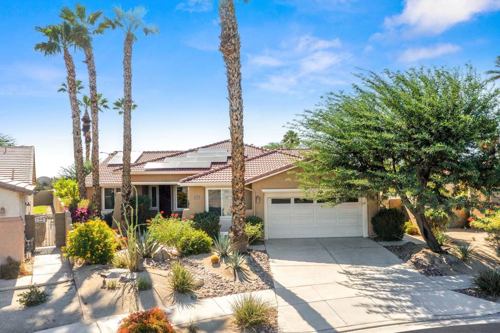 Discover the charm of 69997 Paloma Del Sur, a beautiful residence nestled in La Paloma. This spacious and sunlit home is perfect for both indoor and outdoor entertainment. The bright great room offers a stunning view of a large backyard with desert landscaping, an oversized pool, spa, and breathtaking mountain vistas. The kitchen and great room area features a cozy breakfast nook, granite slab countertops and backsplash, along with stainless steel appliances. This home includes four bedrooms, with one bedroom featuring an adjoining retreat with a private entrance, ideal for use as an office, workout space, or even a private casita. The impressive pool measures approximately 36'x16', accompanied by an eight-person jacuzzi. Additional highlights include mountain views, an outdoor shower, and a sprawling 12,000+ square foot lot. With numerous upgrades and features, this home is a must-see to fully appreciate its offerings.
