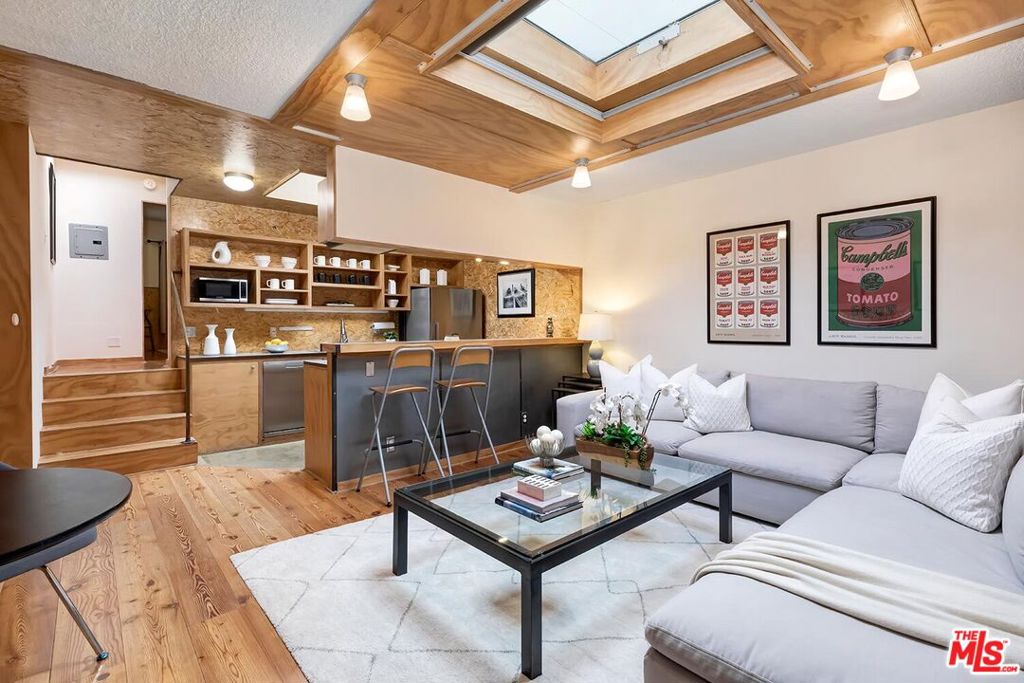 This stunning top-floor condo in Santa Monica exudes the charm of a New York City artist loft. With its high ceilings and multiple operable skylights, natural light floods the space, creating an airy and vibrant ambiance. The open floor plan offers a seamless flow, perfect for both relaxation and entertaining. Industrial-style finishes add character and warmth, while modern design elements ensure a contemporary feel. Experience year-round comfort with a state-of-the-art air conditioning system that has just been installed. Spectacular location, perfectly sited to enjoy the best of Santa Monica! Artistic vibes, great value, and an A+ location, make this unique urban retreat a true one of a kind.