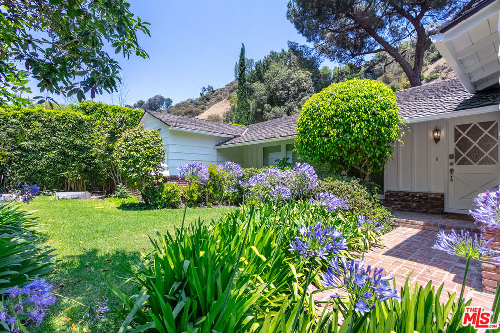 Welcome to 1876 Roscomare Road, a beautifully updated 4-bedroom, 4-bathroom single-level home nestled in prime lower Bel Air. Designed for effortless California living, this light-filled residence features expansive windows and an ideal indoor/outdoor flow perfect for entertaining. Enjoy timeless hardwood floors, a charming fireplace, and kitchen outfitted with updated appliances. The primary suite is complete with custom built-ins and a renovated bath with a soaking tub. A standout feature is the detached bonus room with a private entrance and full bath, perfect for a home office, guest suite, or creative studiooffering flexibility to suit your lifestyle. Located in the highly sought-after Roscomare Road school district and just minutes from Brentwood, Westwood, and Beverly Hills. 1876 Roscomare is the ultimate blend of comfort, convenience, and classic Bel Air charm.