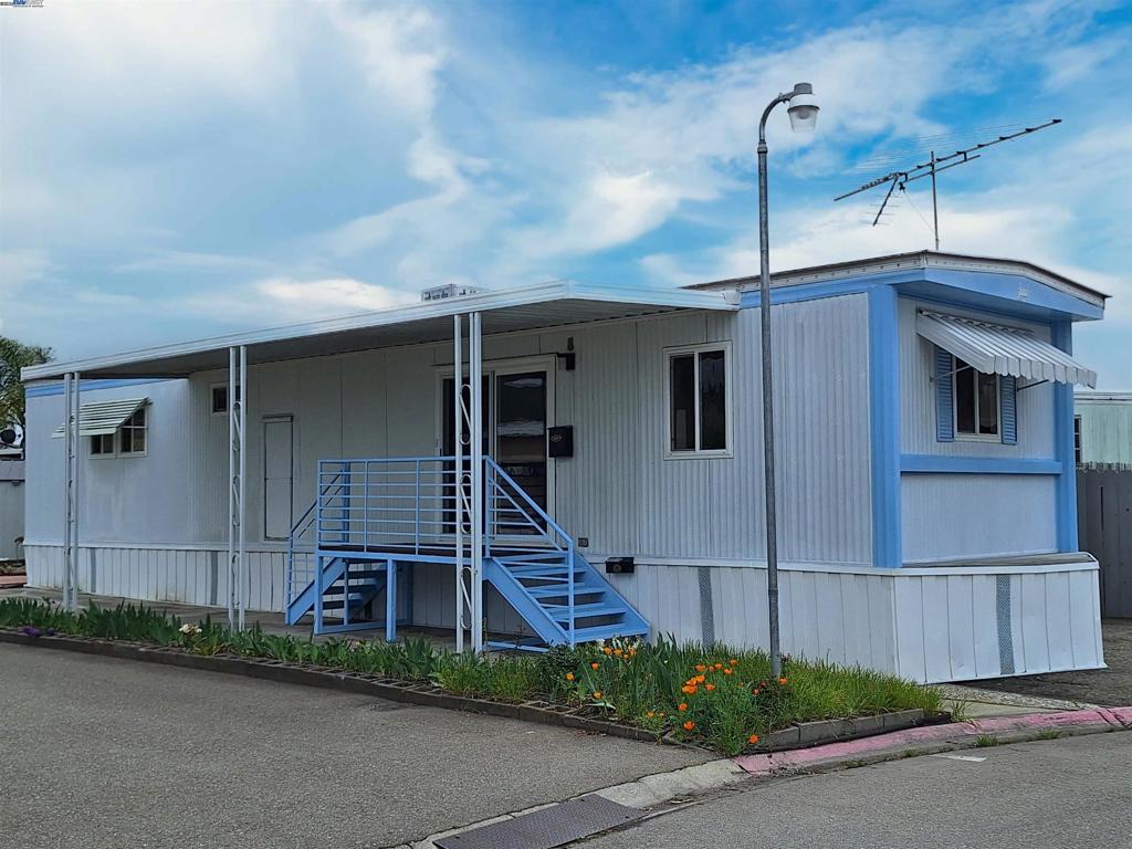 HUGE PRICE REDUCTION . Start Here !!! . . A real Cutie. . . Rarely available Clean Single-Wide with good bones, located in Hayward's Continental Mobile Home Park - a FAMILY community. Cozy 1 Bedroom, 1 Bath. Convenient Laundry Facility is just steps away, across the street. Boasts Energy Efficient Newer Double-Pane Windows throughout and Beautiful Newer Energy Efficient Sliding Door. New Plush Wall-Wall Carpeting, and New Linoleum. Kitchen is Loaded: Instant Hot Water, Upgraded Kitchen with Built-in Oven, Matching Double-Sink, Matching Newer LG Refrigerator, and Garbage Disposal. Home has been professionally leveled. Roof has been well maintained. Large Carport. Large Shed. . . Fireplaces: NO