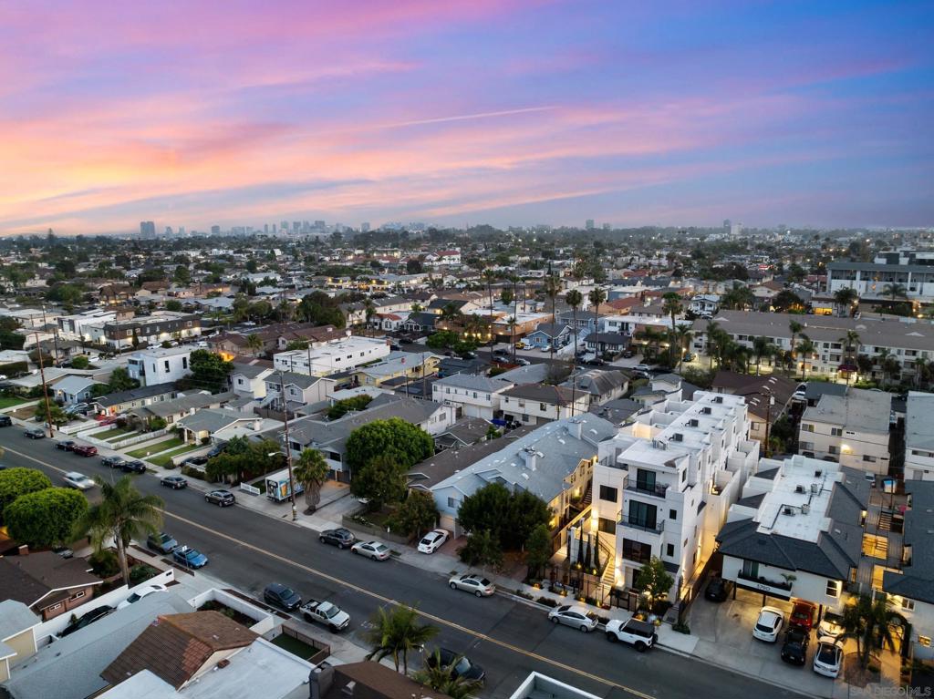 Discover Point North Park, an intimate collection of five newly completed luxury townhomes in the heart of North Park. Each 3-bedroom, 3.5-bath residence spans over 1,500 square feet of open-concept living with soaring 10ft ceilings and floor-to-ceiling windows that flood every room with natural light. Entertain effortlessly on your private rooftop deck with built-in BBQ hookup and panoramic city views or unwind under the stars after a busy day. The chef-inspired kitchen features European-style cabinetry, a waterfall-edge quartz island, stainless steel GE Profile appliances, and a dedicated pantry. The primary suite invites relaxation with 2 walk-in closets and spa-inspired bath retreat and enjoys city skyline views. Perfectly situated within walking distance of North Park’s trendiest coffee shops, craft breweries, farm-to-table restaurants, and the vibrant farmers market, Point North Park delivers the urban lifestyle you crave. Buyers who tour this weekend can choose between an interest rate buy-down for long-term savings or model-home finish upgrades. These townhomes blend luxury, location, and exclusive perks—reach out today to secure your spot in North Park’s most exciting new address. Photos are of models.