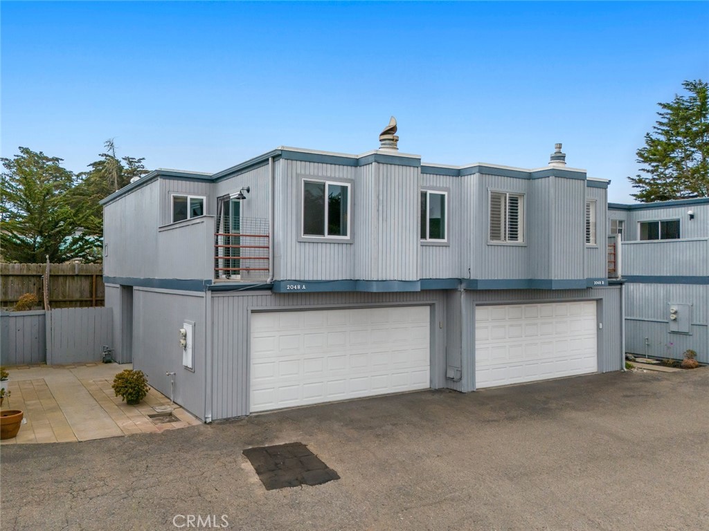 Charming and carefree coastal living awaits in this 2BD/2BA (~1,042 sf) townhome in the desirable Lost Oak Village. Enjoy an attached 2-car garage, cozy gas fireplace, and a thoughtful layout with a bed and bath on each level plus an upper deck for morning coffee or evening sunsets. Ideally located near Baywood, the Elfin Forest, Sea Pines, and Montaña de Oro. The $300/mo HOA takes care of all exterior upkeep—including siding, roofs, driveway paving, common area landscaping, and sewer laterals—plus trash service, so you can focus on enjoying the Central Coast lifestyle.