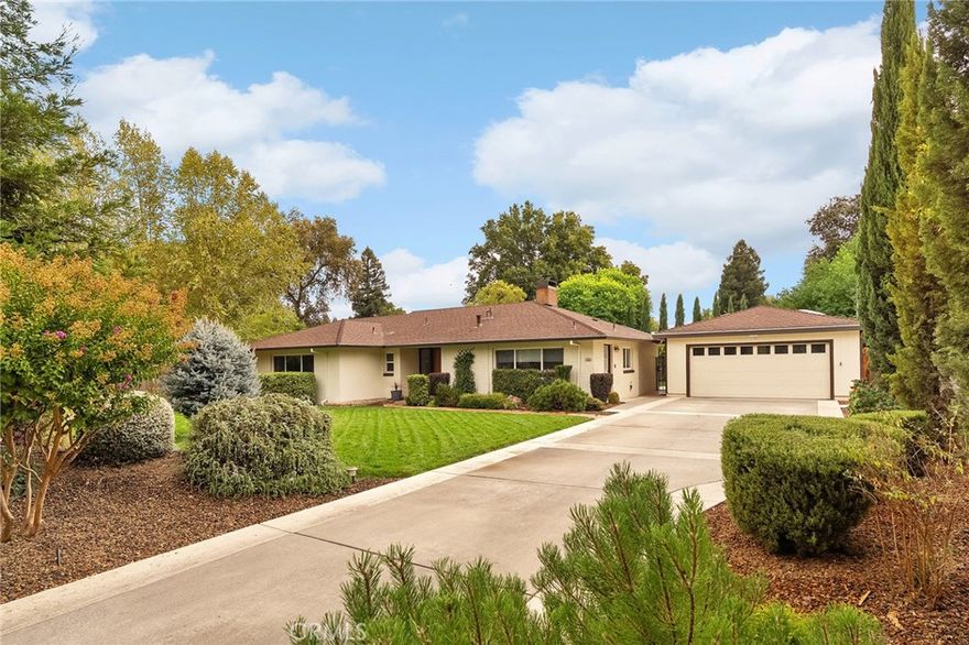 Built in 1951 and lovingly updated, 2158 North Avenue is a rare Chico treasure where timeless charm meets modern comfort. From the moment you arrive, you’ll notice the pride of ownership in every detail, from the stately front door with frosted glass to the lush landscaping designed for beauty and privacy. Step inside and be welcomed by a spacious living room with open wood-beamed ceilings, a dual-sided brick fireplace, and floor-to-ceiling windows framing stunning views of the backyard oasis. The custom-built-in entertainment center and marble-topped bookcases create a gathering space perfect for movie nights, celebrations, or simply curling up with a good book while natural light pours in. The heart of the home is the remodeled kitchen, designed for both style and function. Featuring granite countertops, a center island, custom backsplash, built-in gas range, electric oven, USB outlets, instant hot water, and even a hidden foot-operated motorized trash drawer, every detail has been thoughtfully chosen. Motorized blinds, soft-close cabinetry, and a walk-in pantry add convenience, while the dining area’s open flow makes entertaining effortless. With 4 spacious bedrooms, this home offers flexibility for family, guests, or work-from-home needs. The primary suite is a retreat with ample closet space, while additional bedrooms feature built-in desks, shelves, and large windows that bring the outdoors in. A dedicated office with luxury vinyl plank floors provides the perfect place to work or create, complete with views of the koi pond and waterfall. Step outside and you’ll find a private paradise. The sparkling pool, projector screen for outdoor movies, built-in speakers, and gas-plumbed BBQ area make this the ultimate space for entertaining. Surrounding it all are citrus trees, Italian cypress, and mature redwoods, offering shade, beauty, and year-round enjoyment. The koi pond is stocked with koi and goldfish, complete with a tranquil waterfall and the perfect spot to unwind at the end of the day. Additional features include a whole-house fan, Ring doorbell, Ecobee smart thermostat with a new HVAC system, locking screen doors, and a gas-plumbed backyard grill. The detached 2-car garage also includes a workshop with its own bathroom, perfect for projects, hobbies, or even a home office. For peace of mind, this property is solar-ready, with an array already installed and ready to connect. 2158 North Avenue is more than a home—it’s a lifestyle.