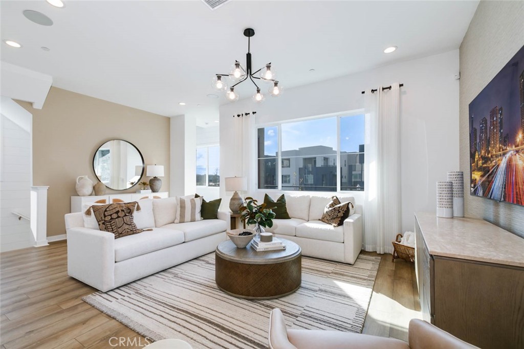 FULLY FURNISHED by a designer, all you have to do is pack your toothbrush! This exquisite move-in-ready model home features 4 bedrooms, 3 bathrooms, and a dedicated office across 2,100 square feet of thoughtfully designed living space. Ideally situated in Solis Park, a vibrant enclave within the prestigious Great Park master-planned community, this residence offers a perfect blend of comfort and convenience. The first floor includes an attached two-car garage, while the second level boasts a spacious great room, a contemporary kitchen, and a bedroom with a full bathroom. The kitchen is elegantly appointed with quartz countertops, upgraded cabinetry, and brand-new stainless-steel appliances. The third floor showcases the luxurious primary suite and two additional bedrooms. Zoned for the highly acclaimed Irvine School District, the home is just a short walk from Portola High School, the K–8 Solis Park School, and the community’s amenities, including a park, pool, and clubhouse. Additional highlights include fully paid-off solar panels and the inclusion of all furniture, TV, and washer/dryer—making this truly a move-in-ready home you won’t want to miss.