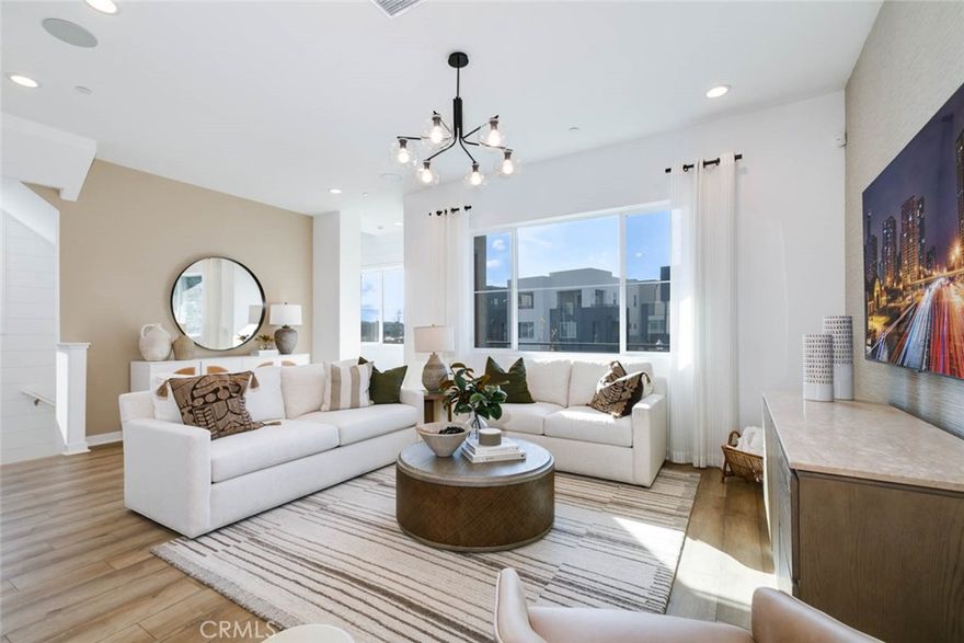 FULLY FURNISHED by a designer, all you have to do is pack your toothbrush! This exquisite move-in-ready model home features 4 bedrooms, 3 bathrooms, and a dedicated office across 2,100 square feet of thoughtfully designed living space. Ideally situated in Solis Park, a vibrant enclave within the prestigious Great Park master-planned community, this residence offers a perfect blend of comfort and convenience. The first floor includes an attached two-car garage, while the second level boasts a spacious great room, a contemporary kitchen, and a bedroom with a full bathroom. The kitchen is elegantly appointed with quartz countertops, upgraded cabinetry, and brand-new stainless-steel appliances. The third floor showcases the luxurious primary suite and two additional bedrooms. Zoned for the highly acclaimed Irvine School District, the home is just a short walk from Portola High School, the K–8 Solis Park School, and the community’s amenities, including a park, pool, and clubhouse. Additional highlights include fully paid-off solar panels and the inclusion of all furniture, TV, and washer/dryer—making this truly a move-in-ready home you won’t want to miss.