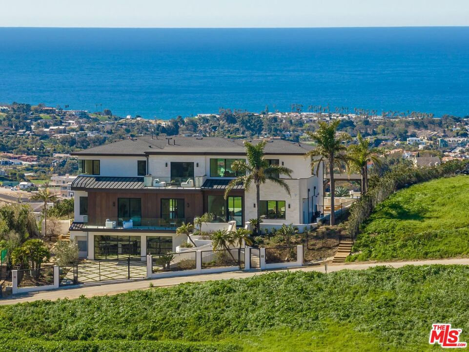 Welcome to your dream home nestled in the heart of the desirable and private Winding Way area on approximately 1.9 acres. This stunning property offers the perfect blend of elegance, comfort, and modern living. As you step inside, you'll be greeted by a grand foyer adorned with exquisite 360 degree views and an abundance of natural light. The open-concept layout seamlessly connects the living, dining, and kitchen areas, creating a spacious and inviting atmosphere. The gourmet kitchen boasts top-of-the-line appliances, beautiful countertops, and ample storage space. Additionally, the main level offers two guest suites with en-suite bathrooms, a gym/office that looks out onto the beautifully landscaped yard, and a bar area perfect for entertaining. Escape upstairs to the luxurious primary suite, featuring an expansive bedroom, generously sized balcony, two walk-in closets, and a private ensuite bathroom with a relaxing soaking tub and a sleek, glass-enclosed shower. The additional bedrooms with ensuite bathrooms are generously sized and offer plenty of comfort and privacy for family members or guests, complete with balconies overlooking the Pacific. Step outside into the backyard oasis, where you'll find a perfectly landscaped garden, trellis-covered outdoor living area with fire pits, and a sparkling swimming pool and spa, perfect for hot summer days and memorable gatherings. Prepare to embark on a new chapter of inspired living, where extraordinary experiences await at every turn. Available for lease for $39,500/month. Lease option available as well.