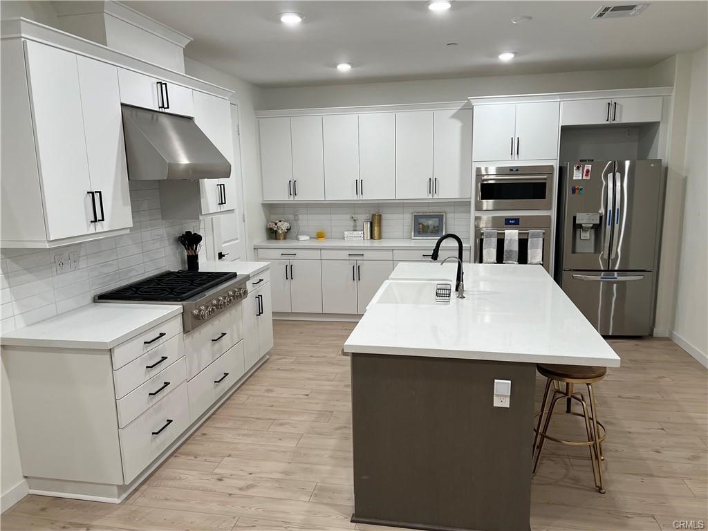 Welcome to 27636 Symphony, a turnkey 3-bed, 2.5-bath contemporary home in Valencia’s new Vesper neighborhood at FivePoint. Completed in 2022, the 2,190 sq ft layout pairs stylish design with smart efficiency: an open great room flows to a chef’s kitchen featuring a quartz-topped island, walk-in pantry, Wolf smart appliances, apron sink and designer backsplash. Upstairs, a generous loft offers flexible work-or-play space, while the primary suite impresses with an oversized shower, dual sinks and custom walk-in closet. Two secondary bedrooms share a full bath, and the laundry room is conveniently on the same level. Energy-saving upgrades include owned solar, tankless water heater, LED lighting, dual-pane windows and programmable thermostat. Relax on the private covered patio or enjoy resort amenities—clubhouse, pools, spa, playgrounds, barbecue areas and miles of paseos—all moments from award-winning West Ranch schools, I-5 and Magic Mountain. Attached two-car garage, low-maintenance HOA living and absolutely move-in ready—embrace the FivePoint lifestyle today!