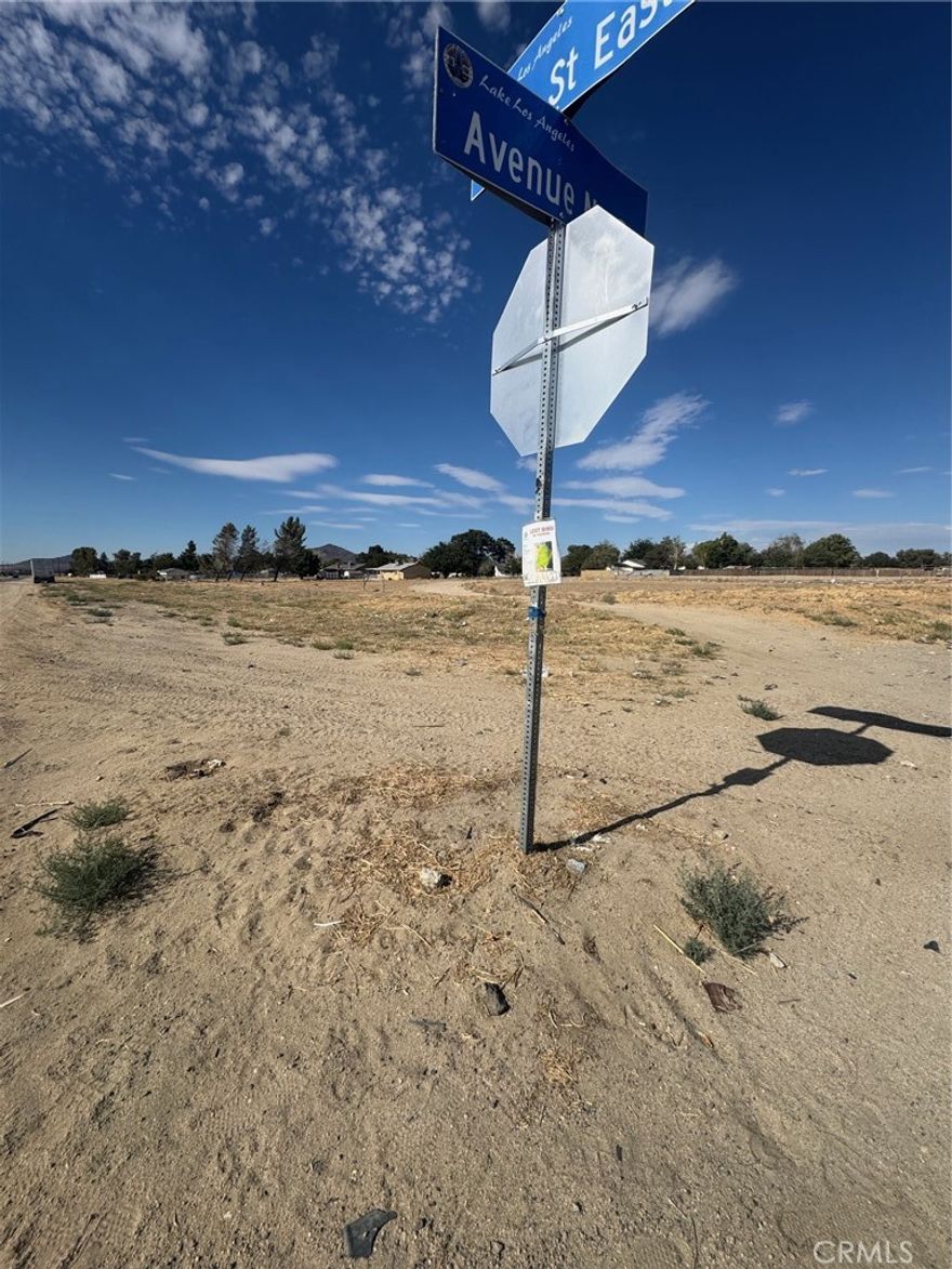 Fantastic Corner Lot in Lake Los Angeles - Over 3/4 Acre! Prime opportunity to own a spacious corner parcel just over three-quarters of an acre in the heart of Lake Los Angeles. All utilities are available, and the property offers excellent access from three directions—making it ideal for building or investment. Just a minute from the town center and zoned for horses, this lot blends rural charm with convenience. Experience peaceful desert living while being only about 30 minutes from the cities of Lancaster and Palmdale. Don't miss this chance to build your dream in a growing community!