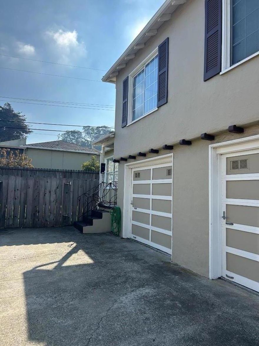 This is a townhouse style duplex in the rear with large yard, newly painted and carpeted, one car attached garage. The yard has an area for boat storage or RV parking, it is very large with double gate access.