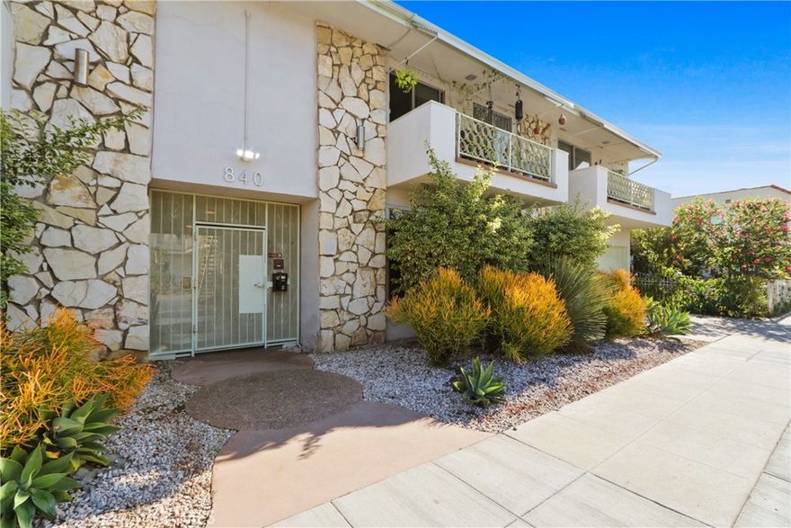 Discover Mid-Century CHARM in this delightful 1960s-era 2-bedroom, 1-bath condo, tucked within a vintage-style complex treasured for its character and warmth. Blending classic retro appeal with everyday comfort, this inviting home offers a refreshing alternative to today’s cookie-cutter designs.
Step inside to a bright, welcoming layout featuring newer laminate flooring, new large sliding doors that open to a spacious private balcony, and a cozy living area ideal for relaxing or entertaining. The kitchen and dining area continue the nostalgic feel with original architectural cabinetry details that showcase timeless craftsmanship. Both bedrooms are generously sized and include built-in cabinets and ample closet space, offering versatility for guests, a home office, or a personal retreat. The expansive bathroom provides abundant storage, a tub/shower combo, a new toilet, and the home benefits from upgraded copper plumbing, new dual paned windows and a new water heater. The beautifully maintained complex enhances the vintage aesthetic with lush landscaping, period-inspired design elements, and a serene, community-centered atmosphere—like stepping back in time in the most charming way. Situated just moments from shops, dining, and everyday conveniences in downtown Long Beach, this condo is perfect for those who appreciate classic style, comfort, and a welcoming sense of community, not to mention a fabulous walkable neighborhood! Don’t miss this rare chance to own an authentic piece of mid-century charm!