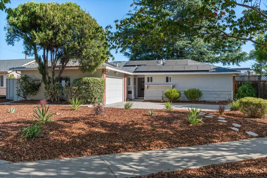 Charming Move-In Ready Home in Prime Los Gatos Location! Located in a highly sought-after neighborhood, this beautifully updated home features a functional floor plan with a freshly painted interior and newly refinished hardwood floors. The refreshed kitchen boasts granite countertops, stainless steel appliances, and ample cabinetryperfect for everyday living and entertaining. Enjoy a warm and inviting atmosphere with a stunning two-way stone fireplace, plantation shutters, spacious bedrooms, and updated bathrooms. Outdoor spaces include a peaceful front area and a generous backyard with a covered patio ideal for relaxing or hosting guests. New A/C and solar system, Finished garage with laminate flooring, Lush green turf and lawn, Long driveway with ample off-street parking, Unbeatable location within walking distance to Vasona Park, Los Gatos Creek Trail, local grocery stores, and restaurants. Easy access to HWY 17 & 85, Downtown Los Gatos, and top-rated Los Gatos schools.