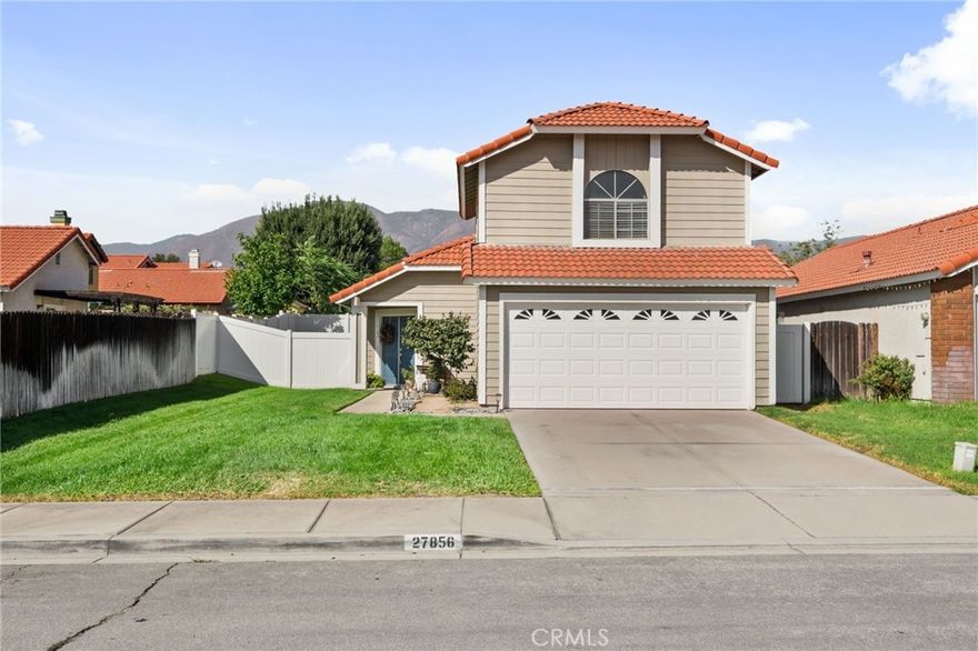 Welcome to this charming two-story home in Highland, perfectly situated on a peaceful street with a lush front yard and an attached 2-car garage with a large driveway. Step inside to soaring ceilings that greet you in the cozy living room, complete with a welcoming fireplace. Adjacent is the bright kitchen, featuring stainless steel appliances, ample cabinet space, and a convenient breakfast bar plus walk in pantry! The dining room offers serene views of the lush backyard, creating the perfect space for family meals or entertaining. A thoughtfully placed half-bath downstairs adds extra convenience. Upstairs, retreat to the expansive master suite, boasting large windows to capture stunning mountain views, generous closet space, and an attached bathroom with dual sinks and its own view-filled window. Two additional bedrooms provide plenty of space for family or guests, each with large closets and bright, inviting windows, along with a well-equipped full bathroom. Step outside to the backyard, where a shaded covered patio awaits for alfresco dining or relaxing away from the SoCal sun. The expansive yard offers a lush lawn, ideal for children to play, pets to roam, or creating your dream outdoor space. With ample parking in the attached garage and large driveway, this home truly has it all. Call us today to schedule a private showing!