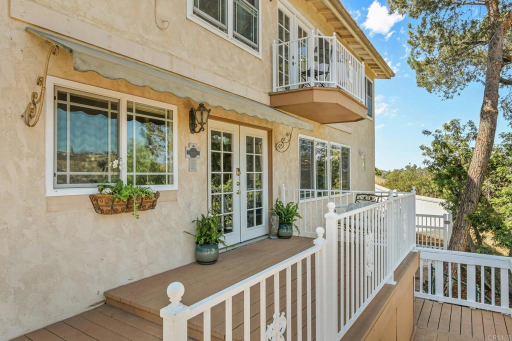 Enjoy stunning views of Cowles Mountain and breathtaking sunsets from this beautifully updated home, filled with thoughtful upgrades, relaxing outdoor spaces, and flexible living spaces. 3 spacious bedrooms, 3 newly renovated bathrooms, and spacious upper floor office, laundry room, and bonus room. The house boasts fully paid solar panels (17) and a new roof with transferable warranty, a tankless hot water heater and an energy-efficient mini split AC/heating system that utilizes the solar for year-round savings. The outdoor living spaces make this house ideal for rest and relaxation. Starting with the sparkling pool with a brand-new vinyl liner and a removable safety fence, all adjacent to a covered patio. The backyard also has mature loquat trees and landscaped gardens. The front deck is perfect for al fresco dining with room for an umbrella and patio furniture. The front lot includes a graded space ideal for play equipment, gardening, or possibly an ADU. The house has an oversized detached 2-car garage with a built-in workbench and cabinets. The concrete driveway was recently installed for decades of reliable access to your home. There is space to park an RV plus 4-5 cars outside of the garage. This move-in ready home offers a rare combination of comfort, energy efficiency, and outdoor enjoyment. With sweeping views and so many upgrades already complete, it’s ready for you to move in and make it your own.
