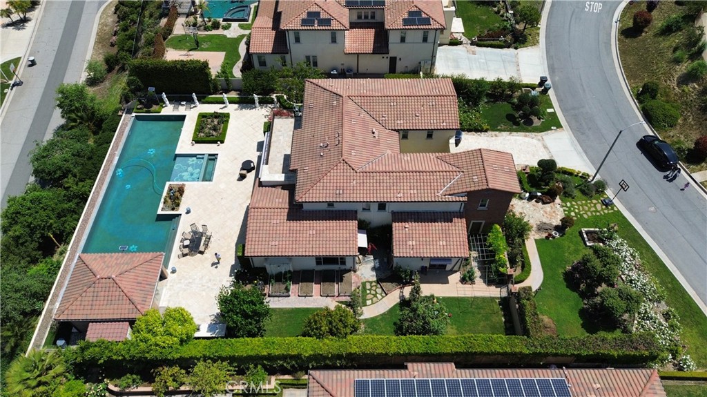 Welcome to this rare and elegant custom estate nestled in the prestigious Magnolia at South Hills community by Taylor Morrison — one of West Covina’s most coveted neighborhoods. Built in 2016 and thoughtfully upgraded in 2017, this expansive luxury residence features 5 spacious bedrooms, each with a private en-suite bathroom, plus a guest powder room — perfect for sophisticated multi-generational living.
Set on a beautifully landscaped 20,473 sq ft lot, the home offers nearly 5,000 sq ft of refined living space. The thoughtfully designed layout includes a main-floor in-law suite, a dramatic great room, a formal dining room, and a custom wine cellar. Stunning marble stone stairs with designer wrought iron railings create a grand and elegant focal point, while the open-concept floor plan extends seamlessly into a stylishly converted California room, blending indoor and outdoor living with effortless grace.
The chef’s kitchen is outfitted with premium appliances, rich custom cabinetry, and a generous center island featuring marble countertops with elegant side falls — ideal for entertaining. It is complemented by a separate second (wok) kitchen, perfectly suited for heavy cooking.
Professionally landscaped front and back yards showcase extensive travertine stone hardscaping, a tranquil courtyard, and lush greenery, completing the resort-style ambiance. Relax in the custom infinity-edge exercise pool or maintain your wellness routine in your private gym caberzo — all within the comfort of your own backyard sanctuary.
Perched on a peaceful hilltop in South Hills, this home offers privacy, expansive skies, and potential city and mountain views — just minutes from South Hills Country Club, top-rated schools, shopping, dining, and freeway access.
This is a rare opportunity to own a move-in-ready estate that truly embodies modern luxury, comfort, and timeless design in one of Southern California’s most exclusive communities.