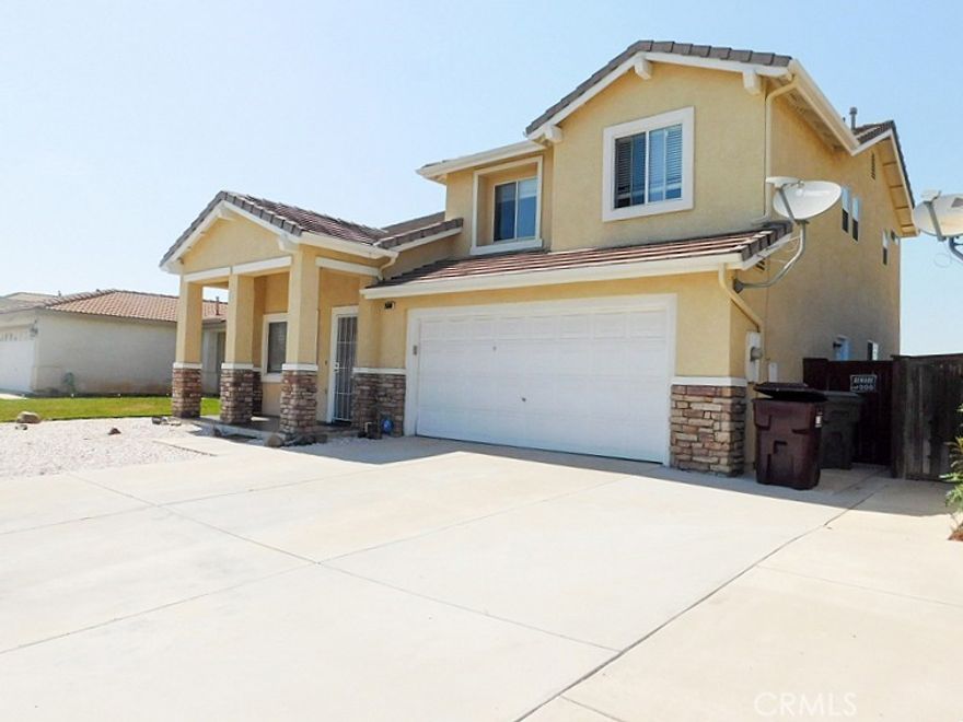 Beautiful Menifee Home in Prime location. Open floor plan home with dark wood floor throughout, 5 bedrooms, 2.5 baths, 2 car garages. One bedroom downstairs convenience for guest room. Kitchen with granite counter top, Cherry wood cabinets, stainless steel appliances, wine cooler & built in wine crack. Roomy upstairs master bedroom, dual sink in Master bath and bathtub. Low maintenance front yard, back yard has large lot for family entertainment and gathering.
