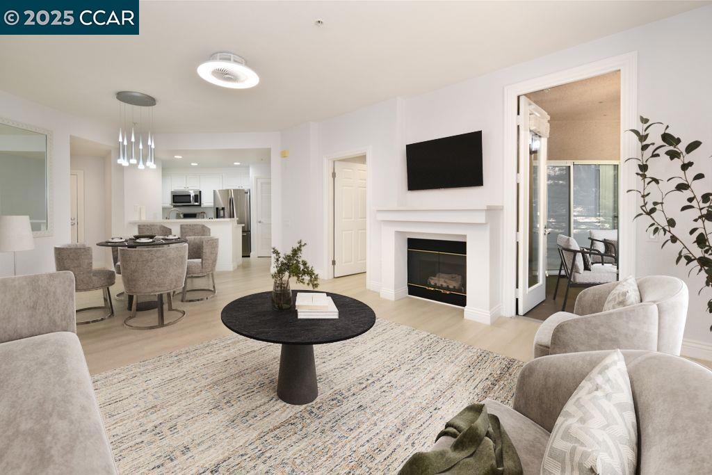 Welcome to this chic and elegant split-bedroom condo, nestled in the highly sought-after Claremont Hills. Located within the beautiful Parkwood Community, this home offers premium amenities that truly define resort living. Enjoy access to a large heated pool, sauna, state-of-the-art fitness center, and an amazing clubhouse to rent and is perfect for hosting gatherings. This unit features two primary en-suite bedrooms, both with walk-in closets and private patios. The open kitchen boasts ample cabinetry, quartz countertops, and stainless steel appliances. Convenience is key with a full-size stackable washer and dryer located in the unit. You'll also benefit from two tandem covered parking spaces with an EV charger, located on the ground level of the building, providing seamless access to your vehicles. For added security, security guard is located at gate house through the evening hours. Ample guest parking for hosting friends and family directly in front of building. Perched against a beautiful hillside, this home offers a peaceful and quiet retreat where you can relax, sip your favorite beverage, and observe local wildlife. A serene lifestyle indeed!! Welcome home!