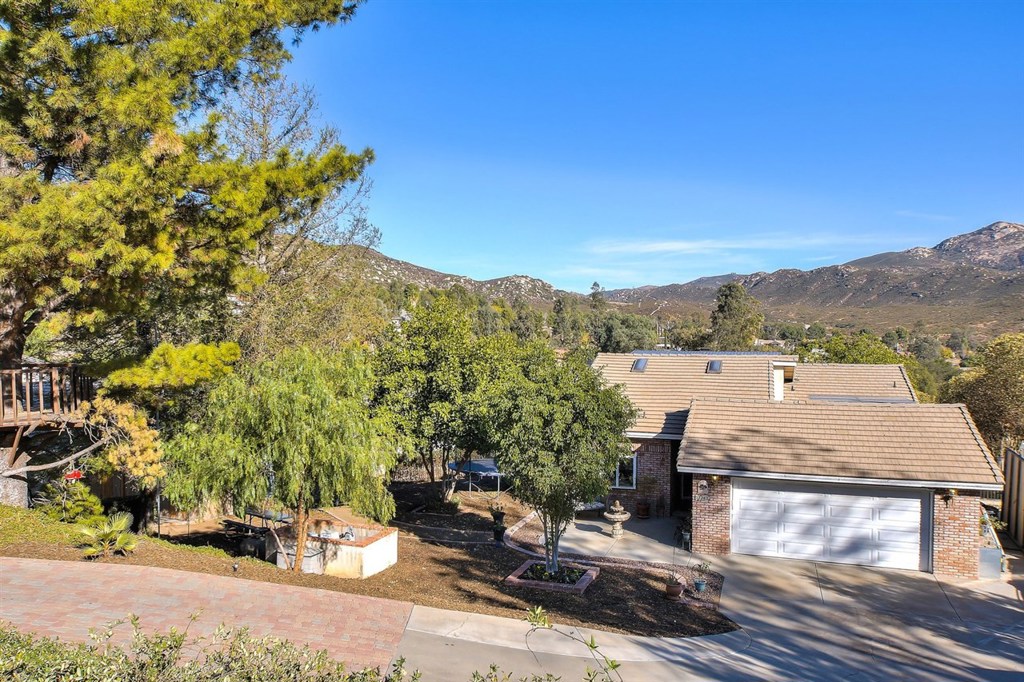 Lot is over 1/2 an acre-Huge back yard with drive-able access to street, RV parking, dog run, solar panels, tank less water heater, large work bench in garage, over-sized tiled custom balcony w/new redwood railings, Beautiful Brick accent wall with wood burning fireplace, Beautiful antique chandeliers throughout, designer paint throughout, crown molding, High Efficient central heating & air conditioning system, High efficient newer washer /dryer & refrigerator. Appliances included-dishwasher, range/oven. Neighborhoods: SDCE Equipment: Dryer, Range/Oven, Washer Other Fees: 156 Sewer: Sewer Connected Topography: LL