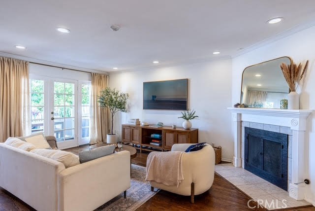 Coastal Living Just Blocks from the Redondo Beach Pier!!! This bright and airy townhome offers 2 bedrooms, 2½ bathrooms, a loft, and a versatile basement in a prime Redondo Beach location, just minutes from the sand and pier. The gourmet chef’s kitchen is a standout feature, boasting elegant Taj Mahal Quartzite countertops that wrap around the expansive waterfall island, along with a wet bar, wine fridge, Samsung top-of-the-line refrigerator, and stainless steel appliances. Both the primary and guest bedrooms feature ensuite bathrooms, and the guest bathroom and powder room have been tastefully updated. The primary suite includes a loft ideal for a home office and a private balcony—perfect for soaking up the sun or enjoying a glass of wine while watching the sunset. Accessible from the attached 2-car garage, the basement offers flexible space for a gym, media room, or bonus area, complete with a convenient washer and dryer. The living room features a cozy gas/wood-burning fireplace and flows to a spacious deck, ideal for barbecues, outdoor dining, or simply savoring the refreshing ocean breeze. Recent updates include a newer furnace and water heater, both replaced just three years ago. Enjoy morning walks to the beach and evenings with breathtaking sunsets. With low HOA dues of only $300 per month, a friendly neighborhood, guest parking, and plenty of street parking, this home perfectly blends coastal lifestyle with everyday comfort.