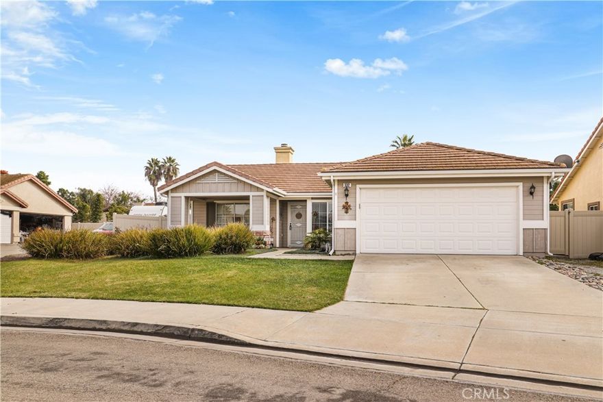 Amazing 3 bedroom 2 bathroom single story home with solar located at the end of a cul de sac in Oceanside. This 1322 square foot property was built in 1999 and sits on a generous 6,570 square foot lot in the Arbor Cove community. The home features a two car attached garage, providing ample parking and additional storage. As you step inside the house, you step into the living room, highlighted by an spacious layout with abundant natural light and a beautiful, colorful fireplace that serves as a focal point of the space. The flooring has been well cared for over the years and features stunning wood laminate flooring flowing throughout the main living areas of the home. The kitchen is the most remarkable room of this house, showcasing a unique turquoise color and stylish design bringing in the beach community feel and flare. It is equipped with ample cabinet storage, tile flooring and a central island with seating for two complemented by stainless steel appliances. Sliding doors from the kitchen lead to the backyard, which features a small covered porch area and pergola, and a well taking care lawn,  providing a pleasant setting for outdoor dining, entertaining, or quiet enjoyment. The laundry room is conveniently located near the bedrooms. The primary bedroom is generously sized and includes walk in closet with mirror doors, a private bathroom with dual sinks, and a walk in shower. The third bedroom offers flexibility and can easily be used as a home office, guest room, or additional living space. All of the bedrooms, exept for the third bedroom,  are finished with carpet, creating comfortable and private spaces for rest and relaxation. This charming home offers a blend of comfort, style, and functionality in a well established community.