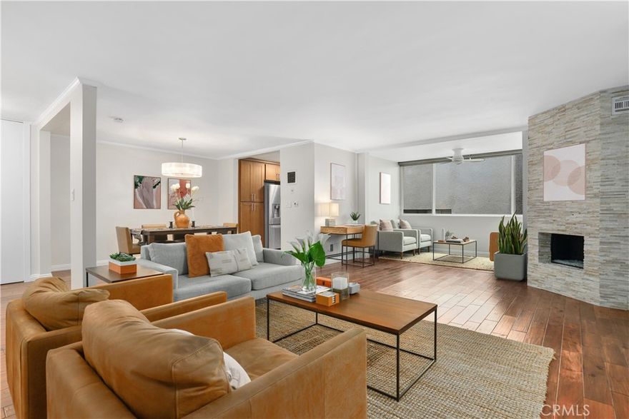 Experience the best of Santa Monica living in this stunning 2-bedroom, 2-bath modern updated SINGLE STORY condo just two blocks from Ocean Avenue which has breathtaking Pacific Ocean views. Spanning 1,369 sq ft on a single level, this open-concept home offers a seamless flow from the spacious living room — featuring rich hardwood floors and a sleek stone-finished fireplace — into the dining area, perfect for entertaining. A versatile den/flex space is bathed in natural light from large windows, offering the perfect spot for a home office or reading nook. The kitchen is beautifully appointed with tile floors, caesarstone countertops, and high-quality stainless steel appliances, including a brand-new dishwasher. The expansive primary suite is a true retreat, complete with a walk-in closet, an additional closet, and a luxurious en-suite bathroom boasting dual sinks and premium finishes. A nice sized guest bedroom and a stylish second bathroom complete the layout. Enjoy the amenities, including an inviting pool, two assigned parking spaces, and an individual storage cabinet. HOA dues cover water, sewer, trash, building maintenance, and insurance (including earthquake insurance). All of this, just moments from Santa Monica Beach, the 3rd Street Promenade, Montana Avenue shops and dining, the famed Santa Monica Stairs, and within an award-winning school district.