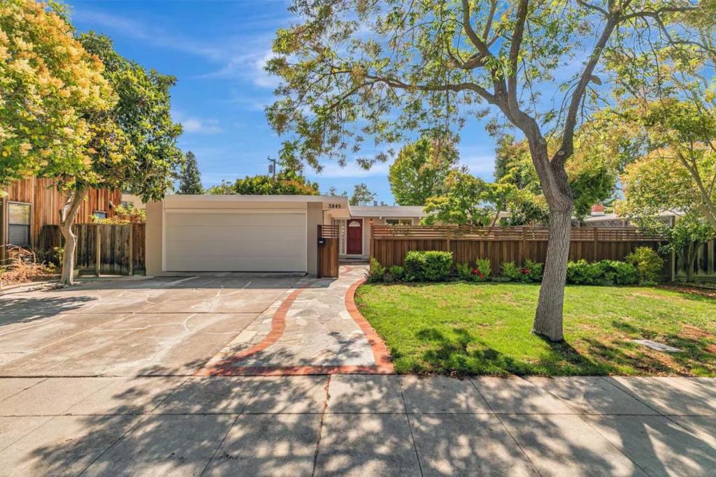 Light-filled and updated 3-bedroom, 2-bath home with a bonus room ( part of the garage conversion, not included in the square footage ) offers both comfort and functionality. The remodeled kitchen features brand-new quartz countertops, new flooring, a new exhaust fan, sink, and faucet, along with ample cabinetry and a large islandperfect for everyday living and entertaining. Adjacent to the kitchen is a dining area. Enjoy the enclosed front patio and an expansive backyard ideal for relaxation, entertaining, and gatherings. The backyard includes mature trees, bushes, lawn, and fruit trees, creating a private retreat. The separate family room boasts a skylight, cozy fireplace, and sliding glass doors leading to the backyard. The spacious master bedroom also features a sliding door with direct access to the backyard and serene views of greenery. Both bathrooms have been remodeled, and the master bath includes a double sink. Located just steps from Ramos Park and minutes from Mitchell Park, the community center, library, schools, and local shops. Enjoy a convenient commute to major Silicon Valley tech companies and access to top-rated Palo Alto schools.