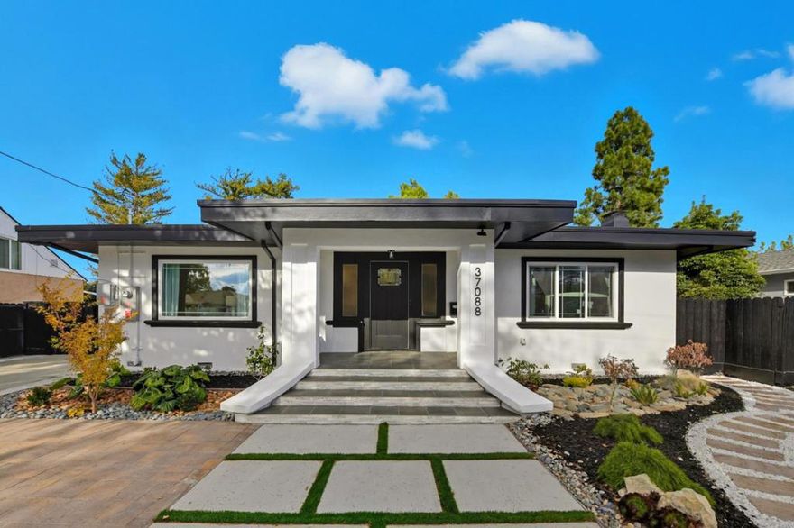 The quiet home backs directly to a large park with a private gate giving instant access to the Newark Civic Center including a new library and planned youth center - an ideal setting for families with kids. Modern upgrades such as solar panels, Tesla charger and powered skylight, dual pane windows make this home energy efficient.  This single-story home is move-in ready, fully renovated with approved permits. It has 5 bedrooms and 3 baths and high-end finishes throughout, including a chefs kitchen with new counters, custom cabinetry, and premium appliances. It features a 2nd master suite at the front overlooks the landscaped yard - perfect for guests or grandparents - while the primary suite includes a generous walk-in closet.  The spacious detached garage with private entrance can be converted into a workshop or ADU as desired. Centrally located in a peaceful neighborhood, this home is close to many conveniences such as I-880, Dumbarton Bridge, Meta campus, restaurants, shopping, and more!