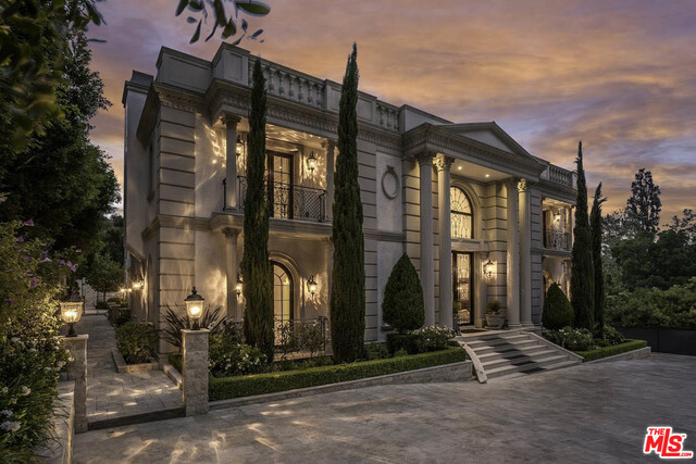This Neo Classically inspired estate, located in the heart of prime Bel-Air sits on over 4 acres of ultra-private land. Enter through the opulent grand foyer and double staircase that showcases the 30ft ceilings with exquisite crown molding. The home features imported marble, fine hardwood floors, Corinthian columns, and rare precious stones in the bathrooms and counter tops. The main floor consists of a spacious living and dining room, a kitchen and breakfast room with butler's pantry and expansive kitchen cabinets. Upstairs is home to the master suite, boasting his/hers walk in closets and baths, as well as a weather control winter closet. The upper level terraces afford tree top, canyon, and reservoir views, with an additional 3 en suite bedrooms. This regal estate comes with a full size billiards room, indoor LED controlled pool, both wet and dry saunas, an elevator, a wine cellar, a movie theater room, a master study and library with wood finishes, and a 2 story 2 bd guest house.