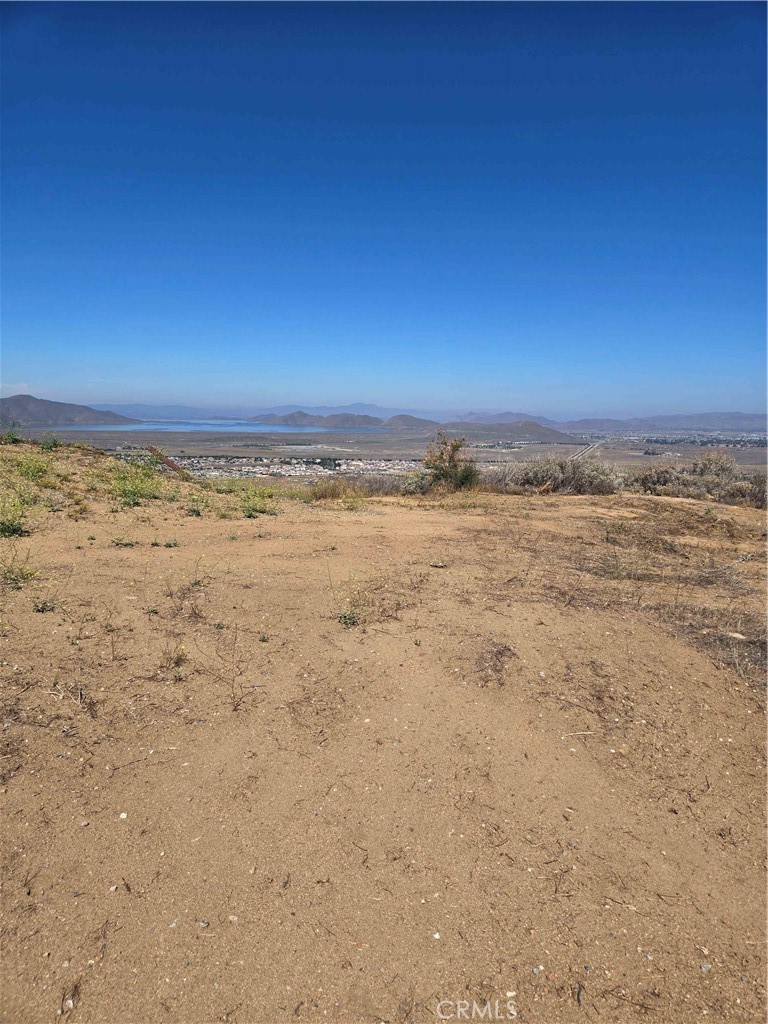 Diamond in the Rough!
This exceptional 5.2-acre parcel offers breathtaking panoramic views of Diamond Valley Lake and the picturesque valley below. Located in a peaceful, rural setting, it’s the ideal spot to build your dream home, vacation retreat, or investment property.
Zoning: R-A-2 which is Residential Agricultural zone intended for single family dwellings and light farming uses.
Utilities: Water and power available at the street.
Access: Paved road directly to the lot ensures easy access year-round.
Topography: Gradable pad.
Enjoy quiet country living while still being close to amenities. Just minutes to Hemet shopping, schools, and healthcare facilities. And with Diamond Valley Lake right at your doorstep, outdoor activities like fishing, hiking, and boating are just minutes away.
Don't miss this rare opportunity to own a prime piece of Southern California land with stunning lake and valley views!