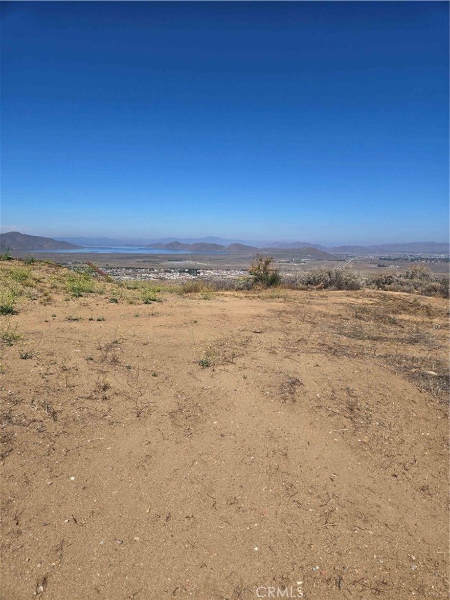 Diamond in the Rough!

This exceptional 5.2-acre parcel offers breathtaking panoramic views of Diamond Valley Lake and the picturesque valley below. Located in a peaceful, rural setting, it’s the ideal spot to build your dream home, vacation retreat, or investment property.



Zoning: R-A-2 which is Residential Agricultural zone intended for single family dwellings and light farming uses.



Utilities: Water and power available at the street.



Access: Paved road directly to the lot ensures easy access year-round.



Topography: Gradable pad. 



Enjoy quiet country living while still being close to amenities. Just minutes to Hemet shopping, schools, and healthcare facilities. And with Diamond Valley Lake right at your doorstep, outdoor activities like fishing, hiking, and boating are just minutes away.



Don't miss this rare opportunity to own a prime piece of Southern California land with stunning lake and valley views!