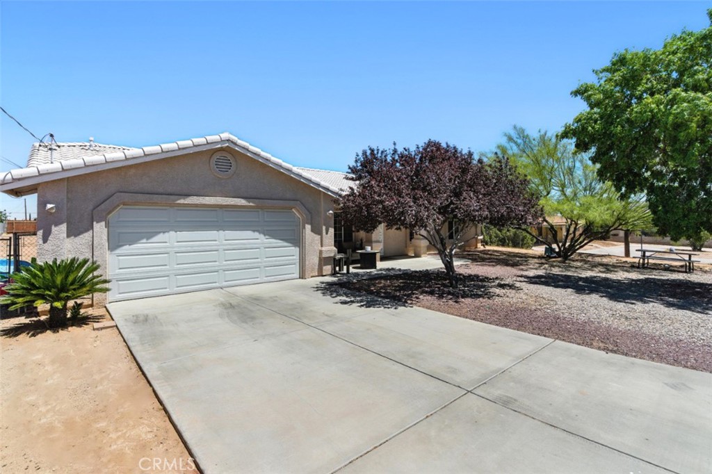 This spacious and well-cared-for home features four bedrooms, three full bathrooms, and sits on a large lot offering plenty of room for outdoor living and entertaining. Located in a convenient and desirable area close to shopping, dining, and everyday essentials, this property combines comfort, space, and a great location—ideal for families or anyone looking for a move-in ready home with room to grow.